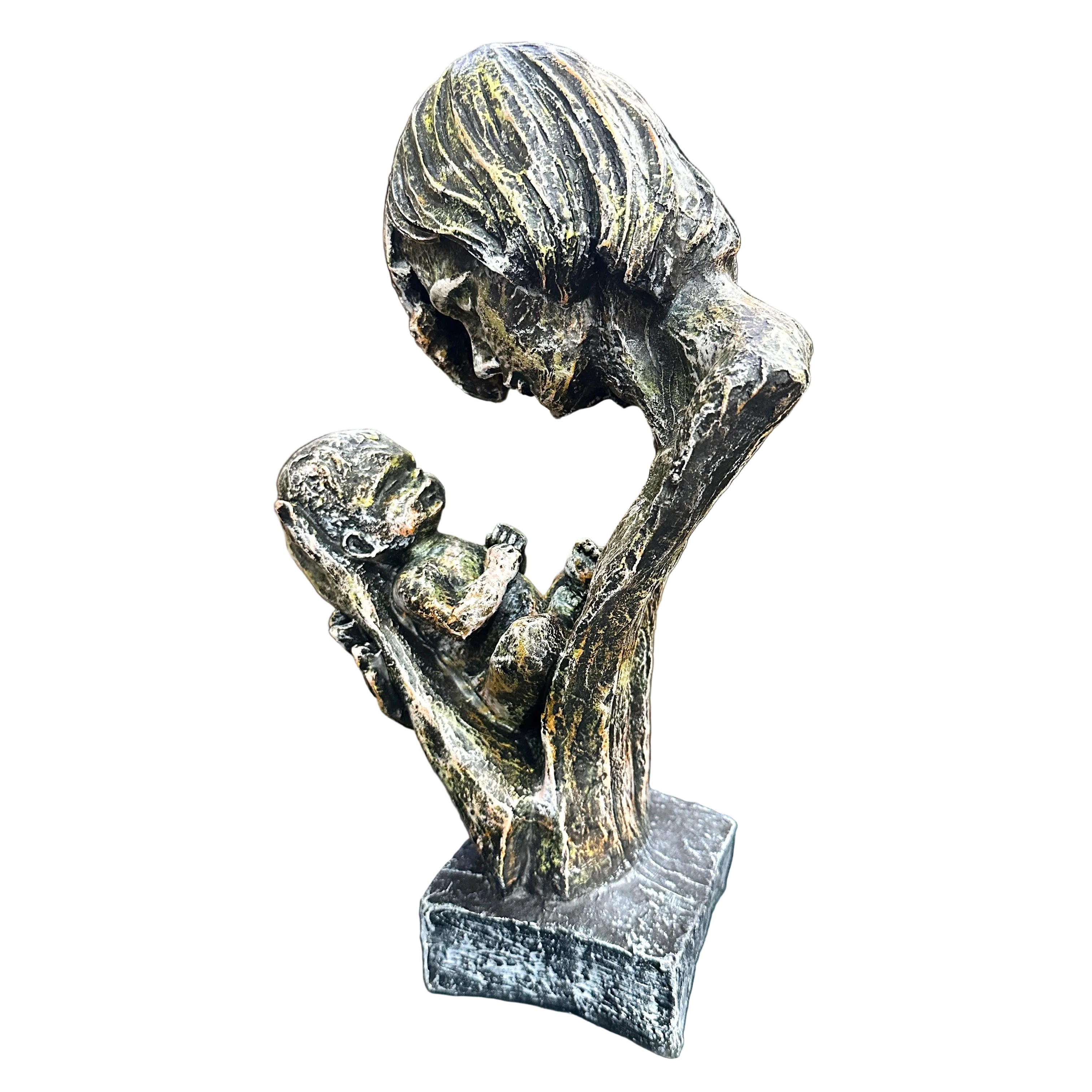 Bronze sculpture of a family on a table with a blurred background