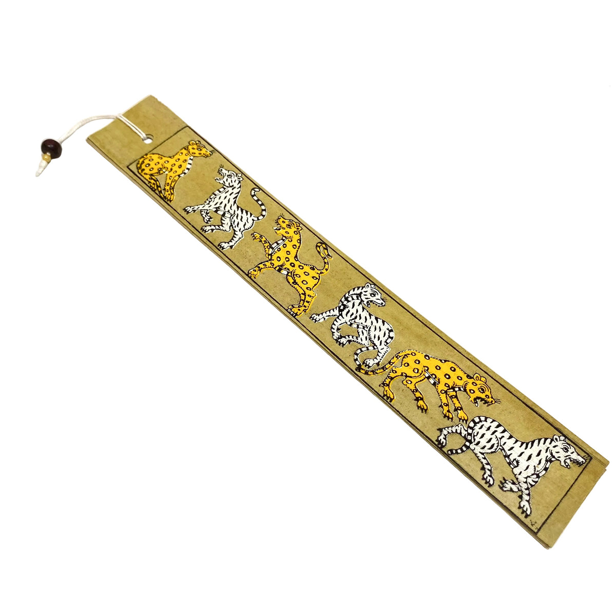 A rectangular tan leather bookmark featuring a printed pattern of running animals in yellow, white, and black, with a small dark bead and white cord attached at one end, photographed on a light off-white surface.