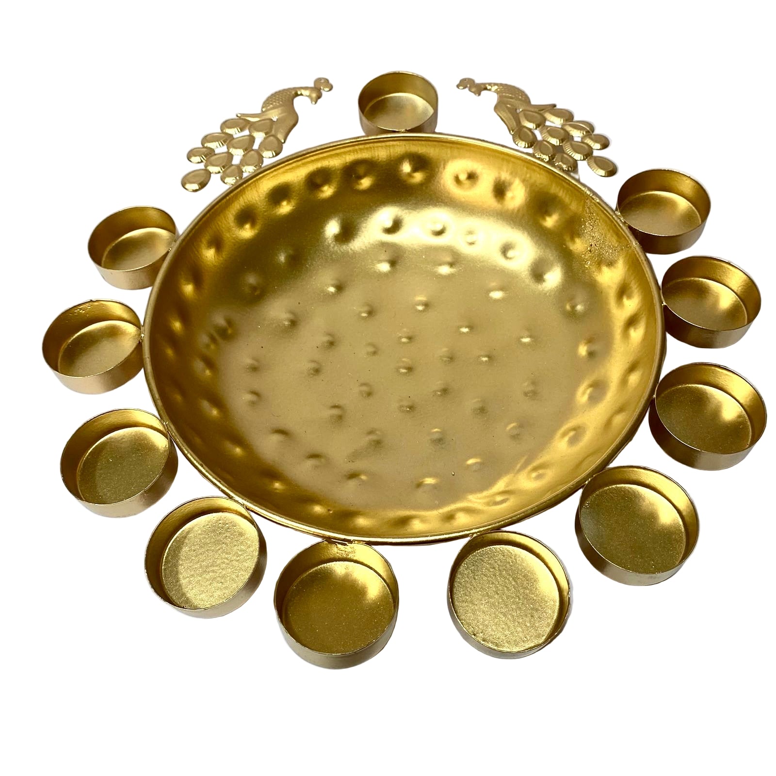Decorative gold tray with circular designs on a white background