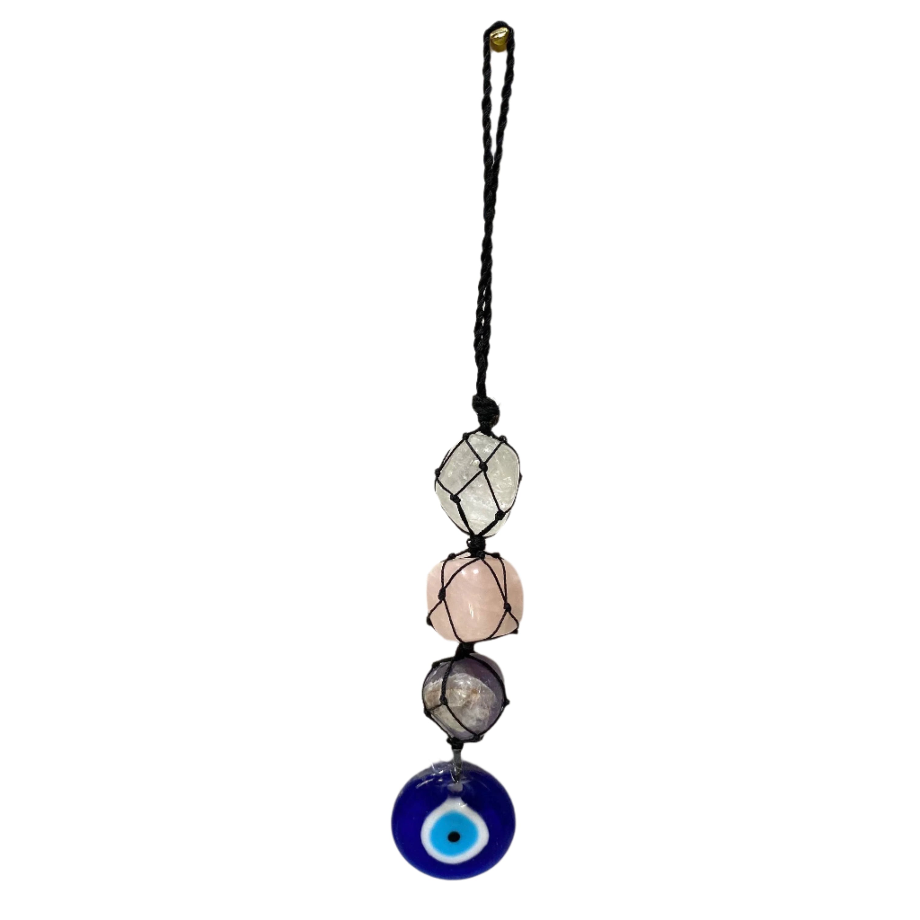 Decorative pendant with beads and an evil eye charm on a white textured background