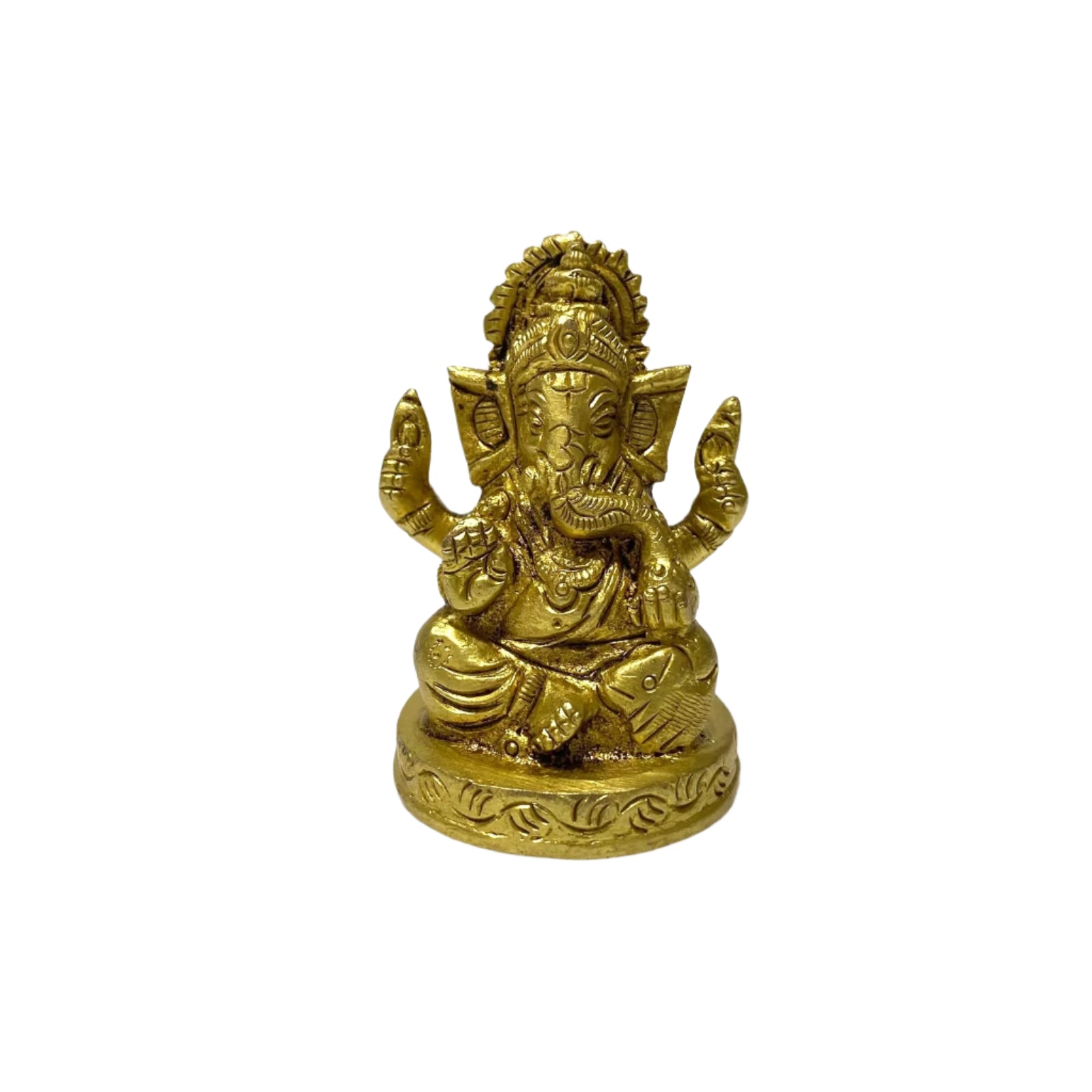Brass statue of a deity on a white fabric background