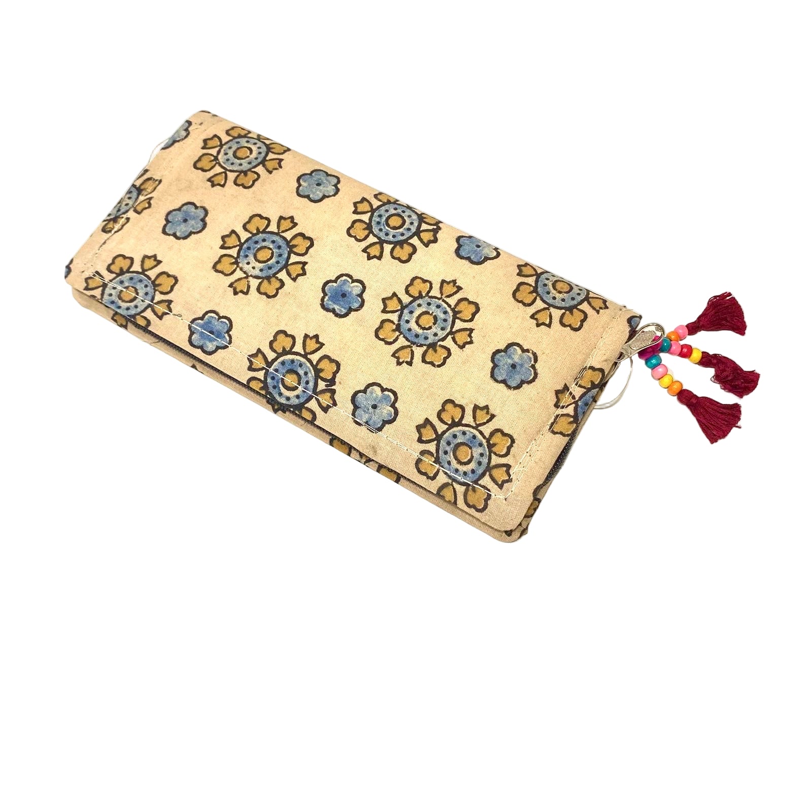 Beige clutch bag with floral pattern and colorful tassels on a white background