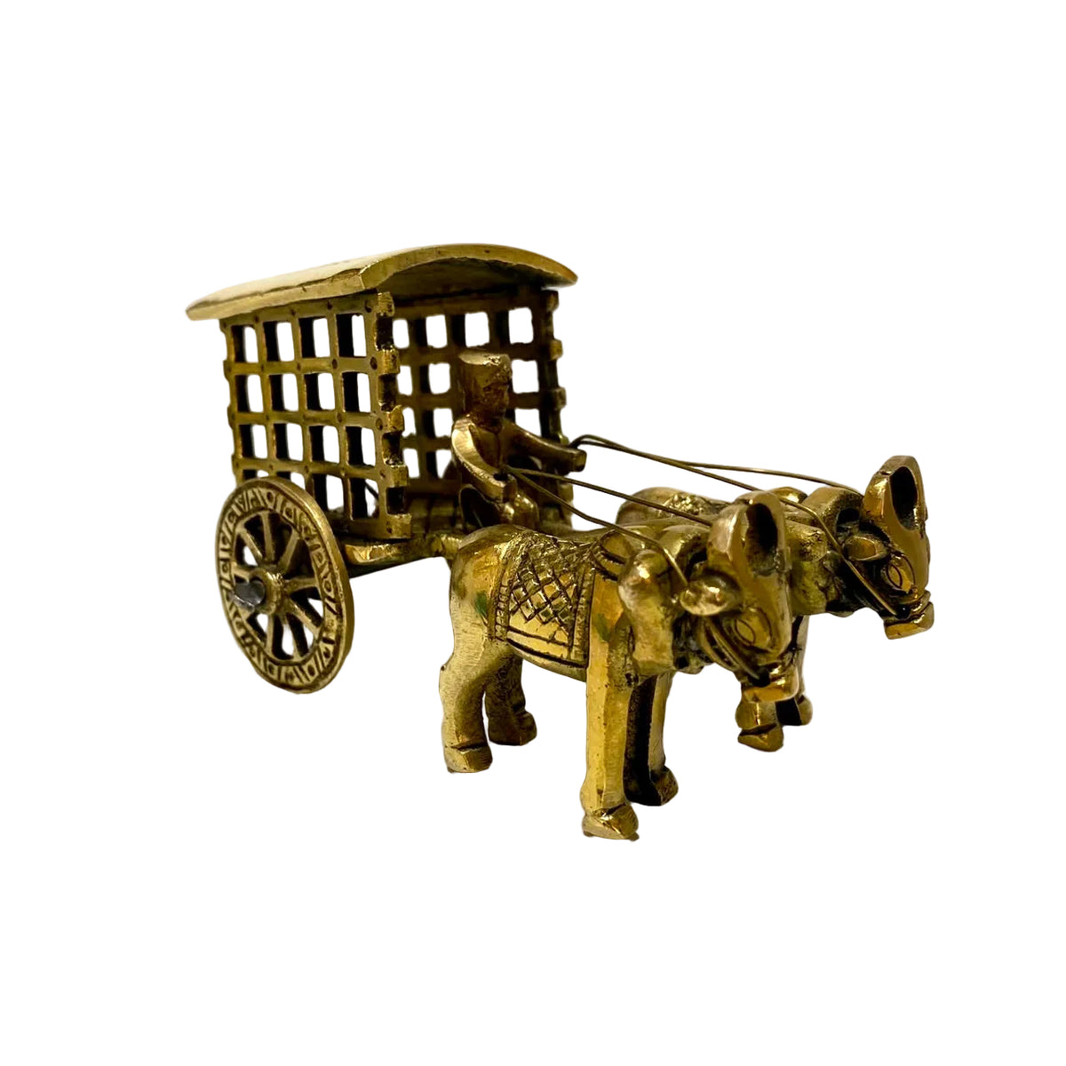 A small brass miniature of a two-horse cart with a driver, photographed on a white tabletop against a plain light background.