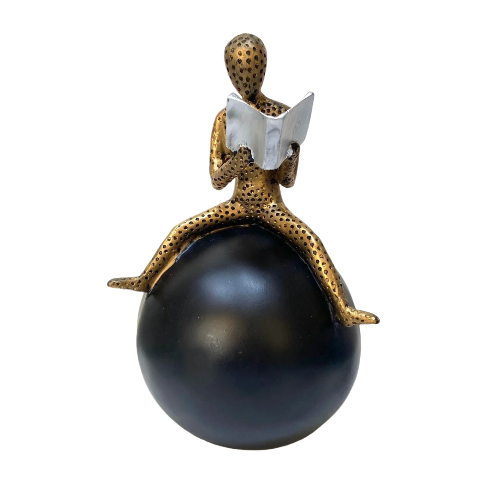 Decorative statue of a person sitting on a large black sphere with a book, on a white background