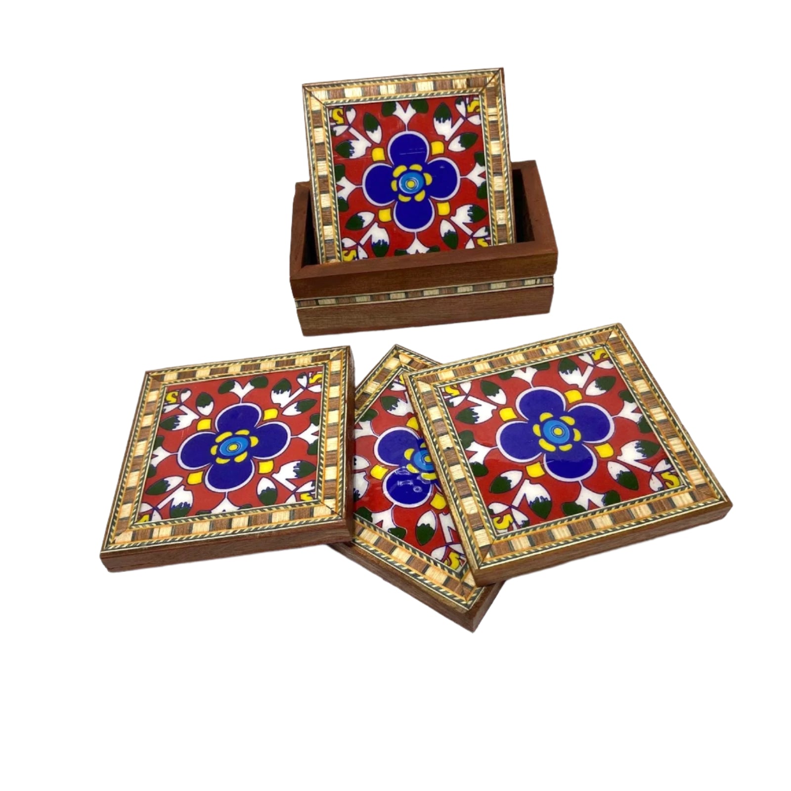 Set of decorative coasters with floral design on a wooden base.