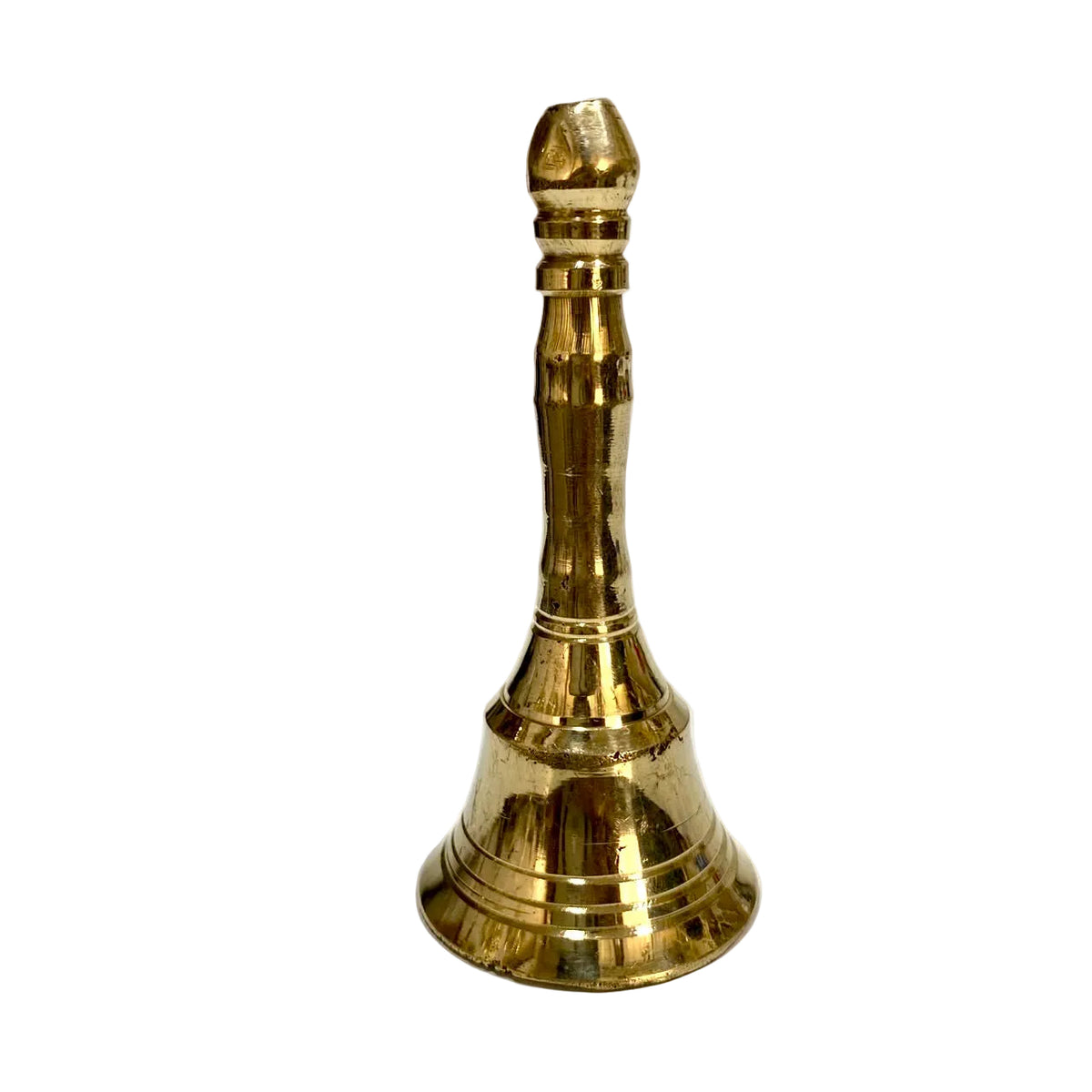 A polished brass bell with a flared base and a ribbed neck, standing upright on a white surface against a plain light background.