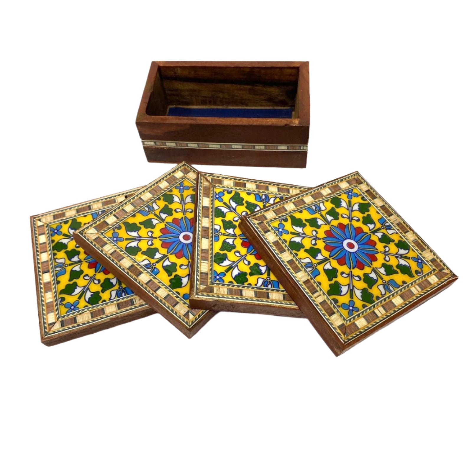 Set of four decorative coasters with a wooden box on a white background