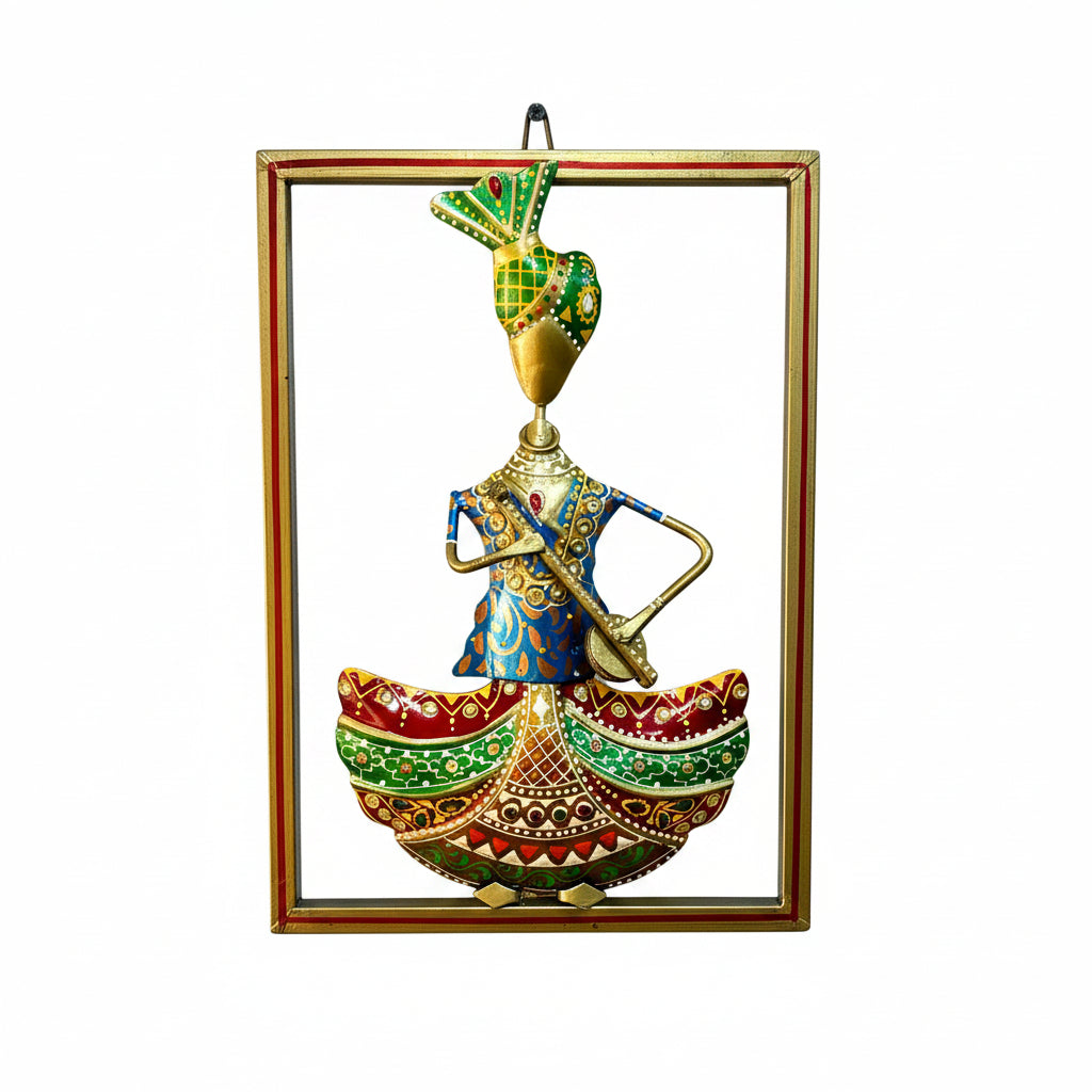 Decorative wall art of a figure in a boat with intricate designs, framed in gold on a textured white wall.