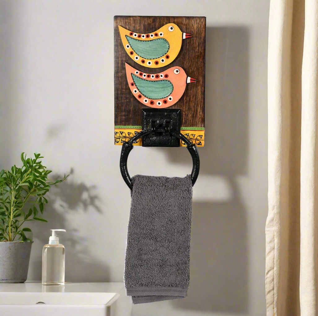 Towel ring with decorative birds on a wooden background