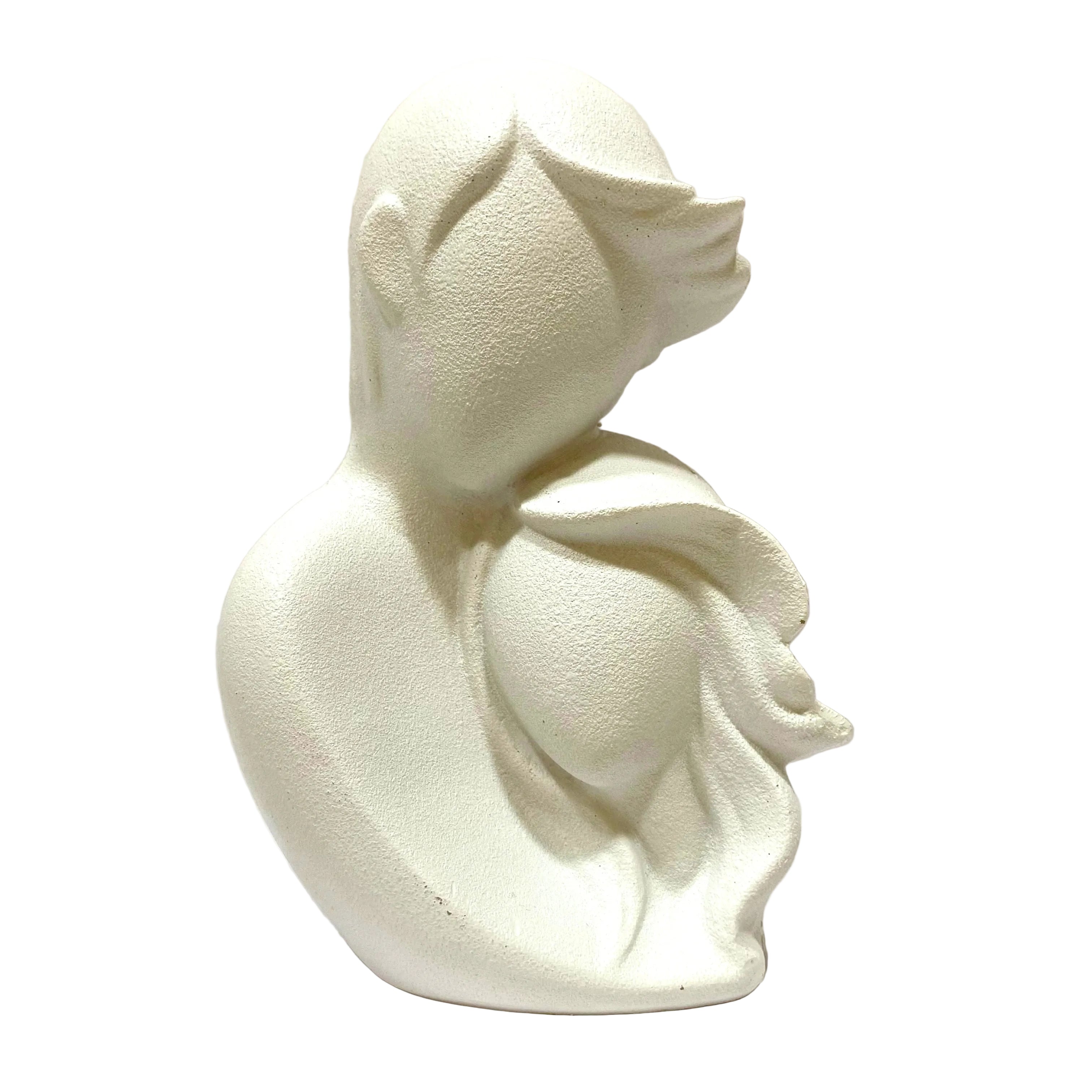White ceramic duckling on a white background