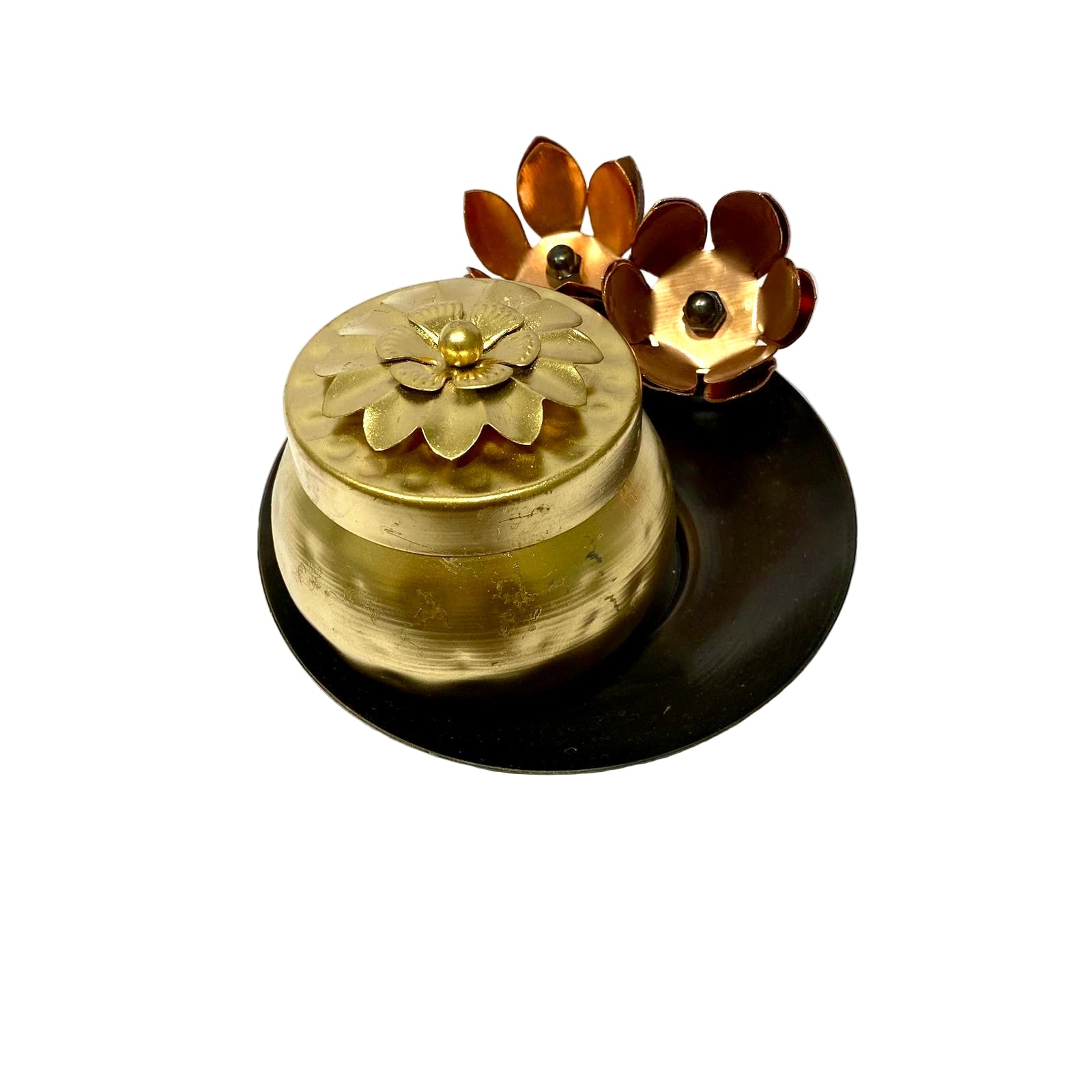 Brass bell with floral design on a white background