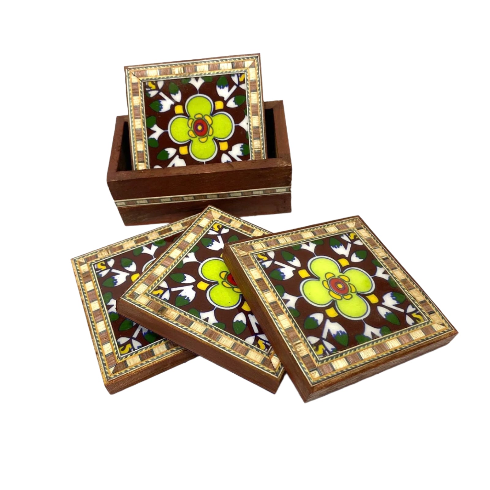 Set of four floral coasters with a wooden box on a white background