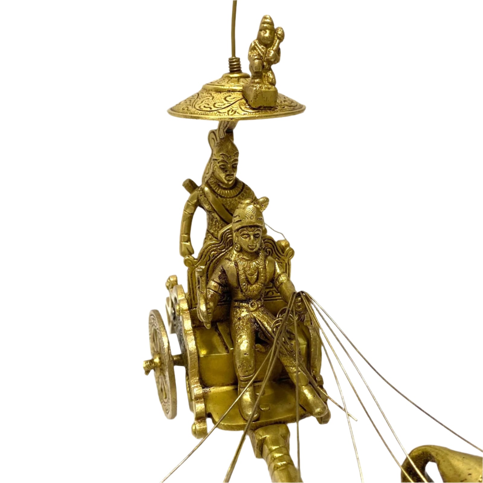 Gold-colored chariot sculpture with figures on a textured white background