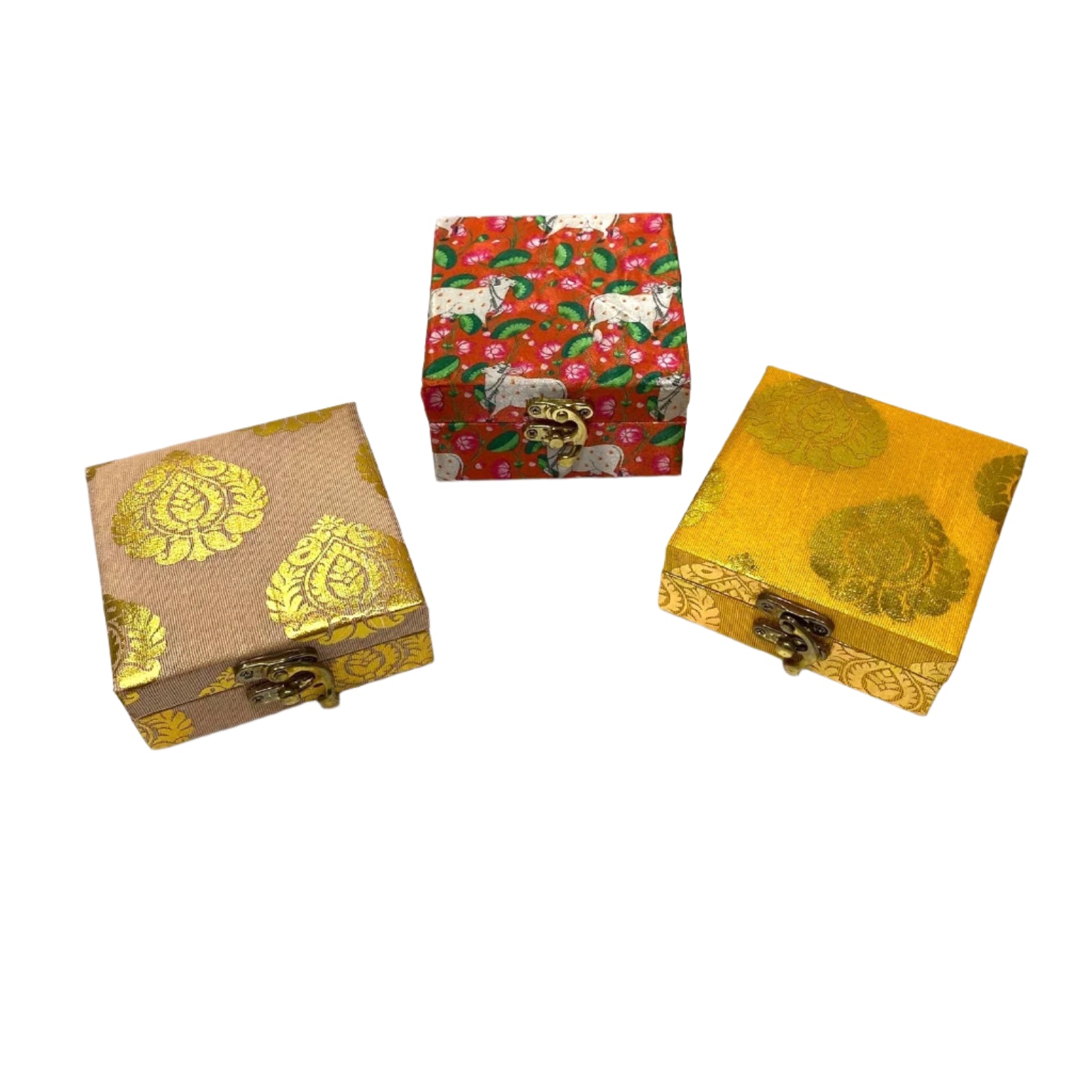 Three decorative boxes with gold patterns on a white background