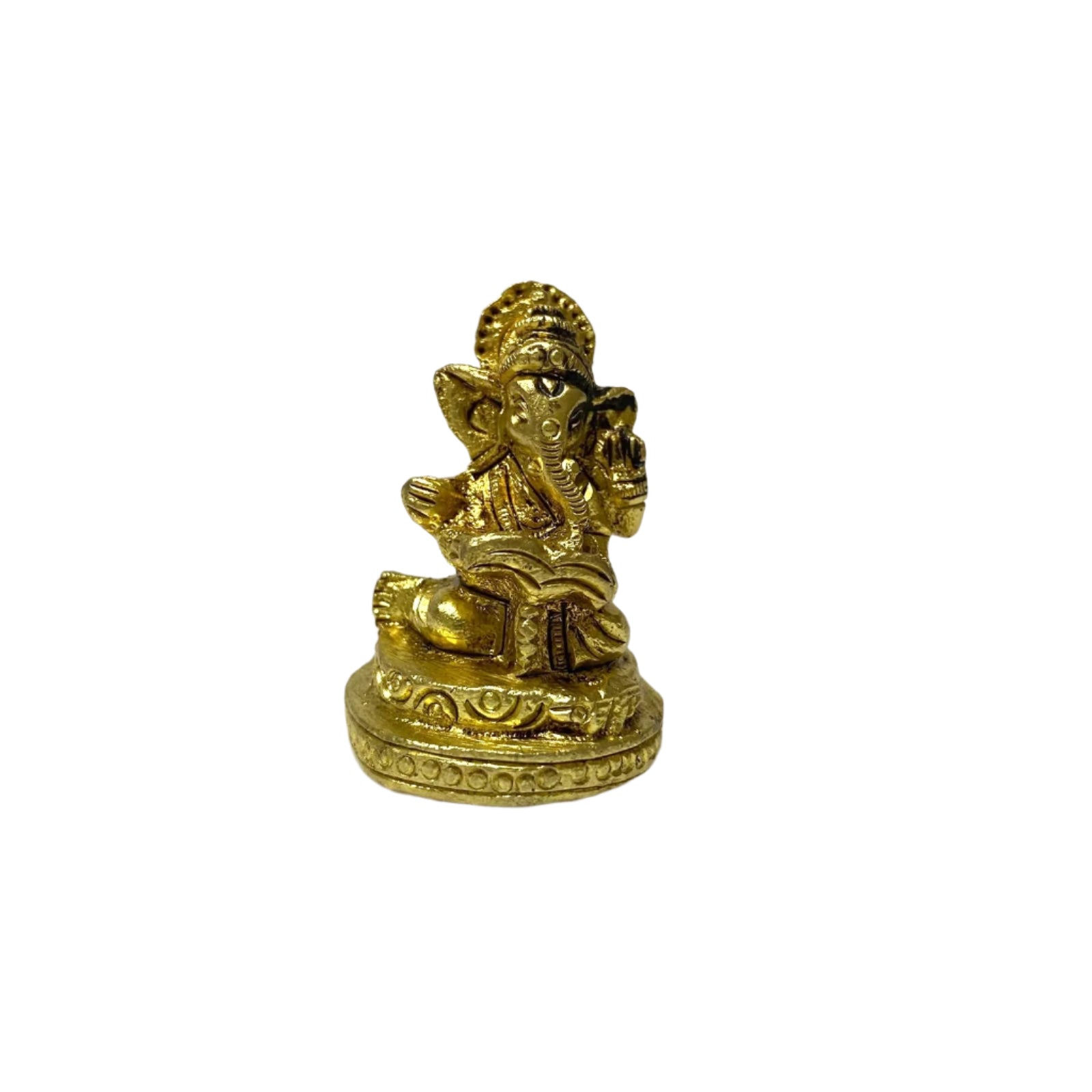 Gold-colored statue of a deity on a white textured surface