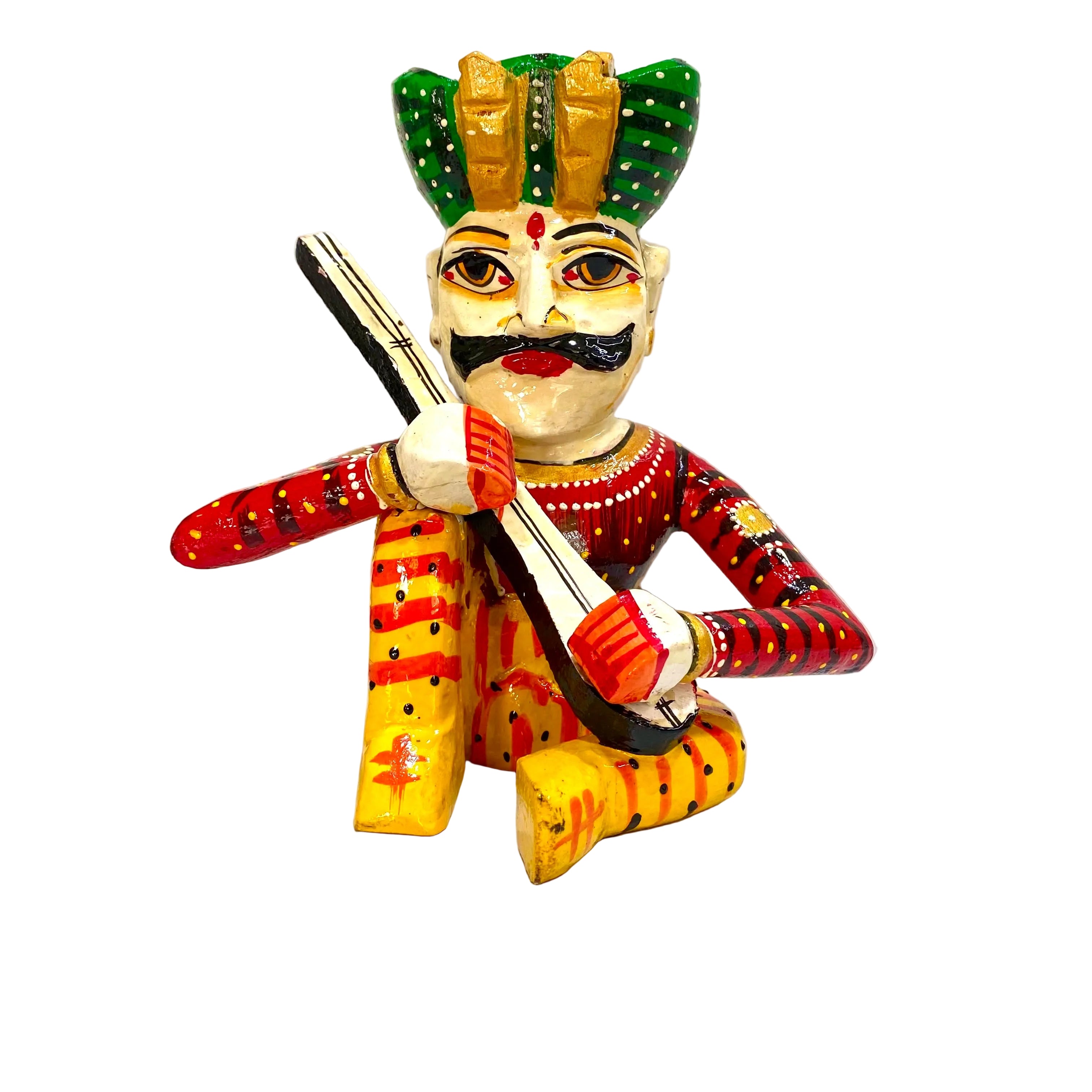 A hand-painted wooden folk art figurine of a seated musician playing a flute, decorated with vibrant red, yellow, green, and black patterns, set against a plain white background.