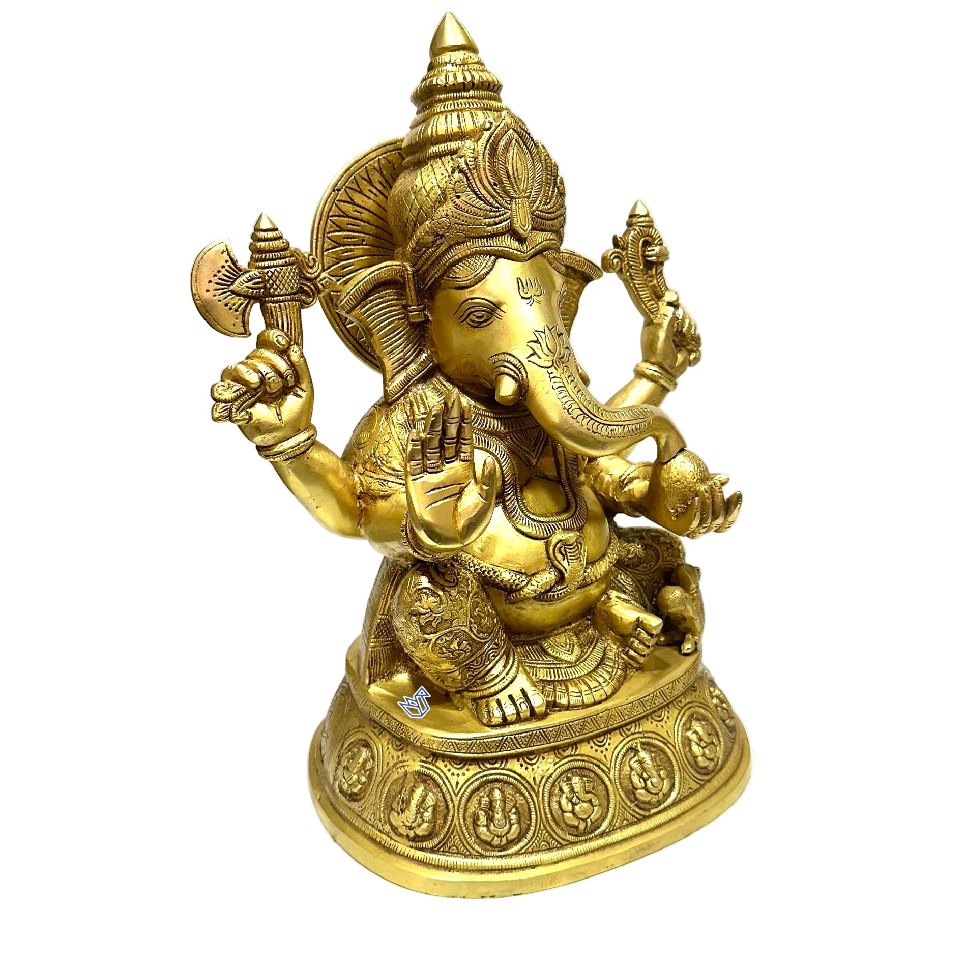 Gold-colored statue of a deity with intricate details on a white surface.
