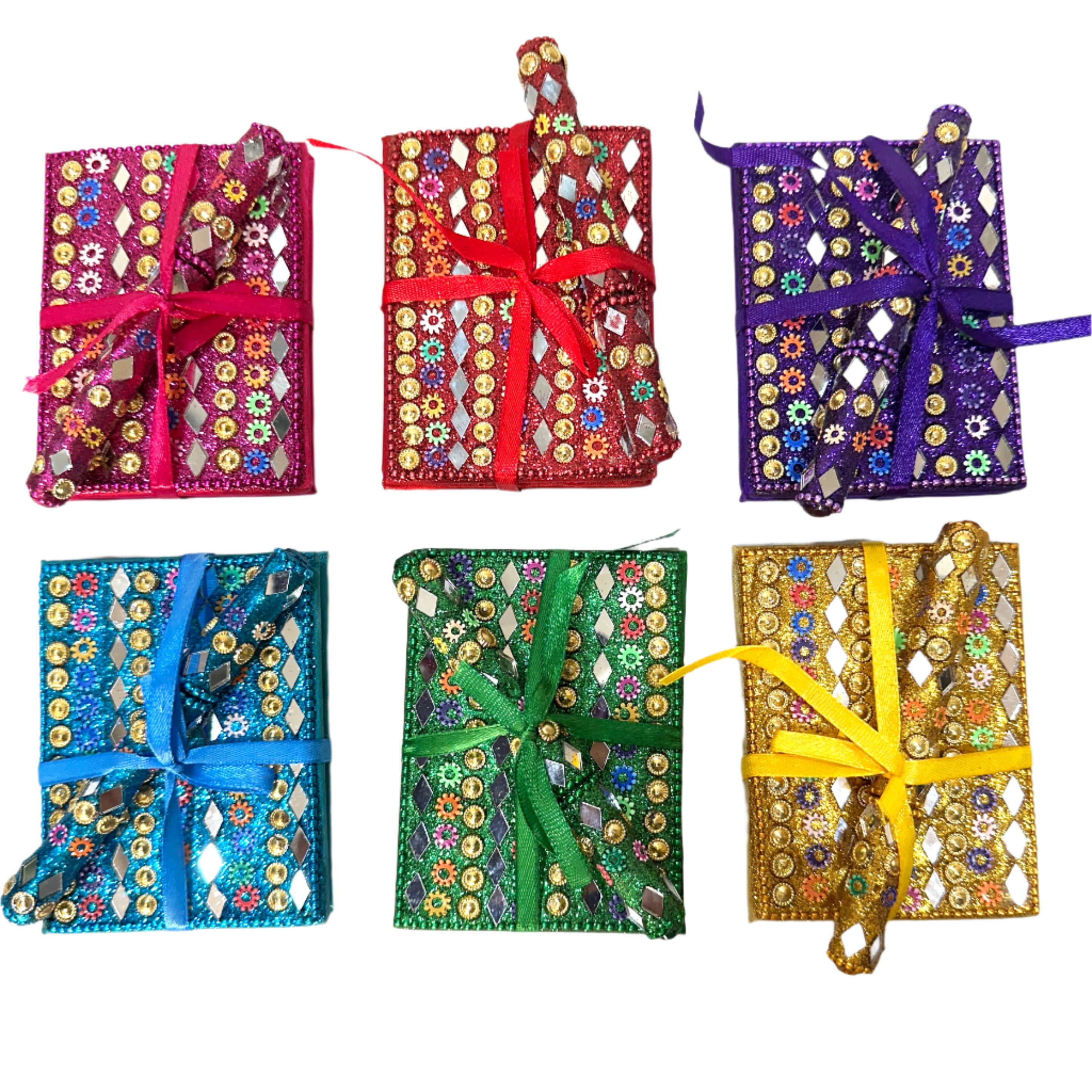 Colorful embroidered fabric packages with ribbons on a white background
