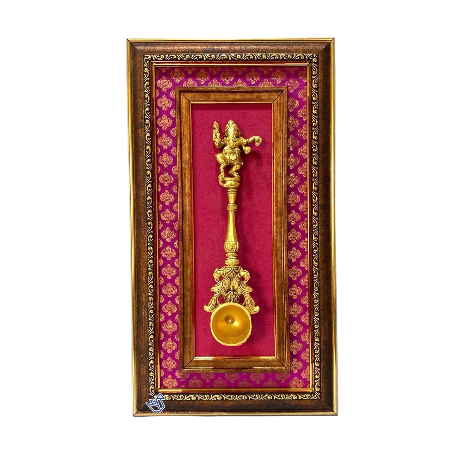 Decorative wall art with a gold figurine and red background in an ornate frame.