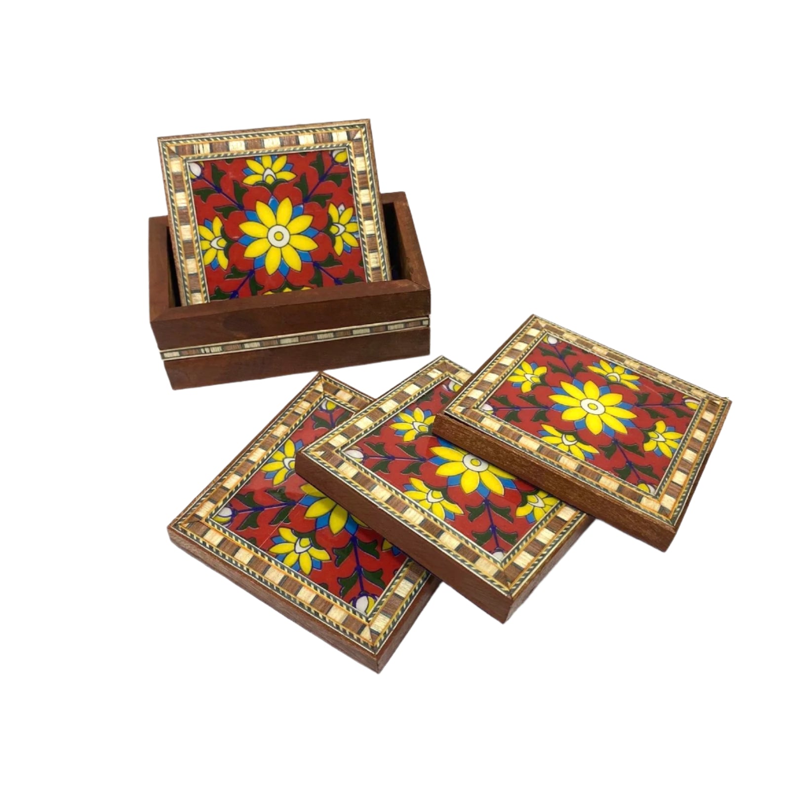 Set of wooden coasters with floral designs on a white surface