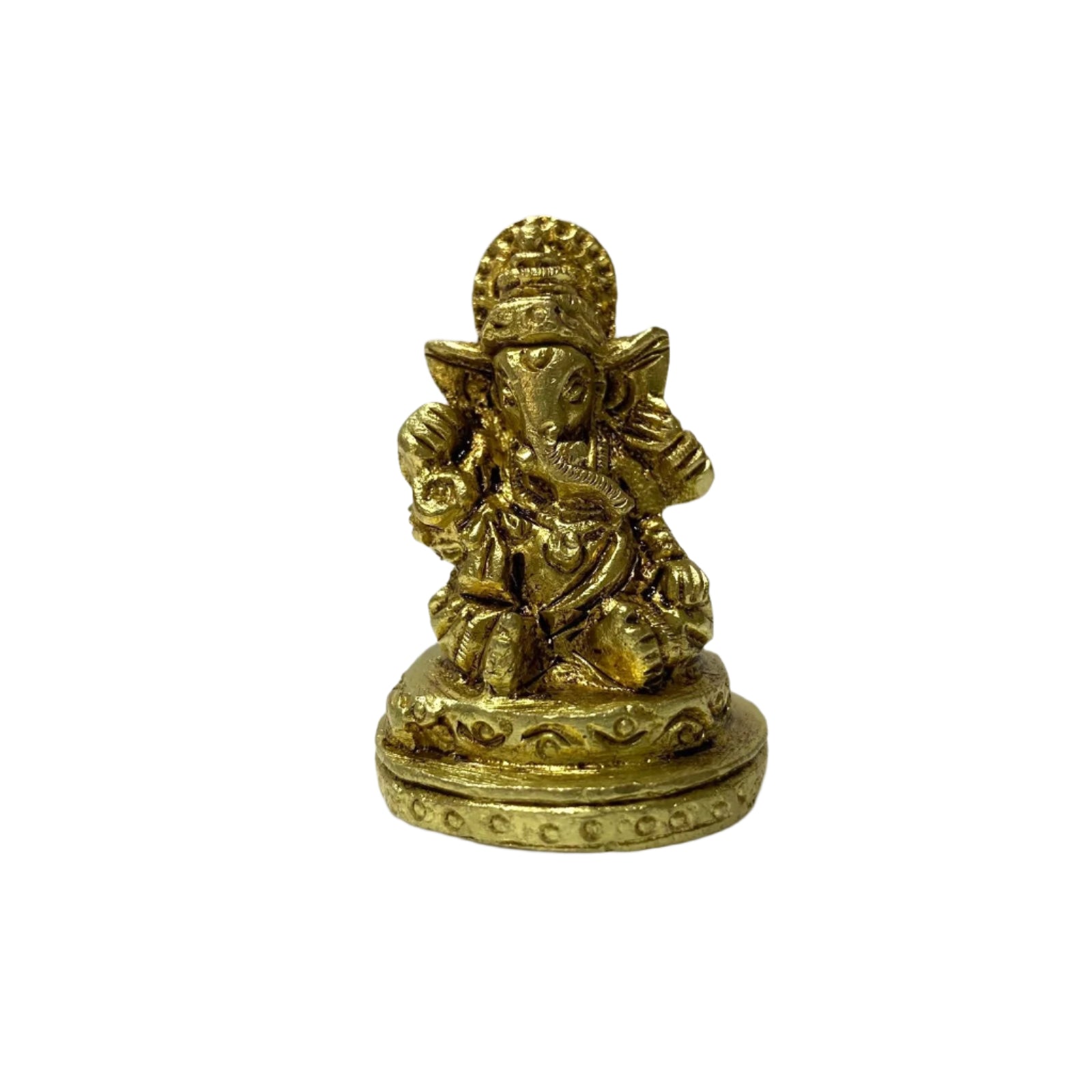 Gold-colored statue of a deity on a textured white surface
