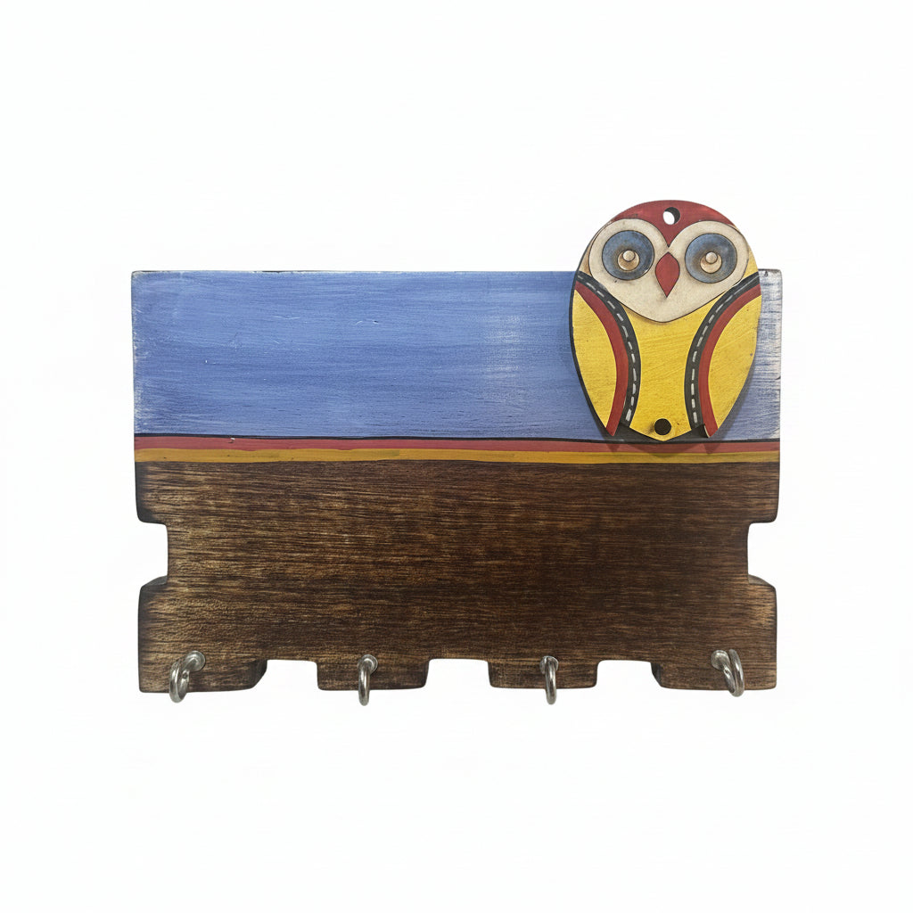 Wooden key holder with an owl design on a white background