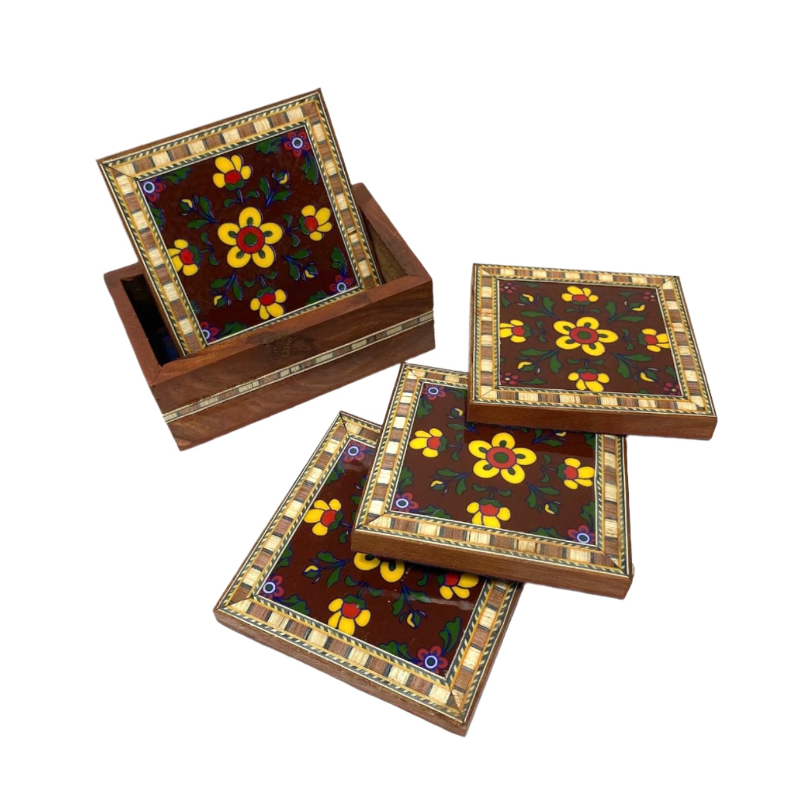 Set of wooden coasters with floral designs on a white surface
