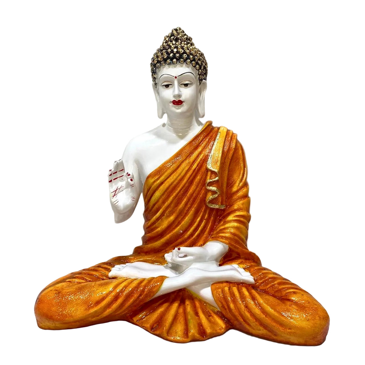 Statue of a seated Buddha figure with orange robes on a white background