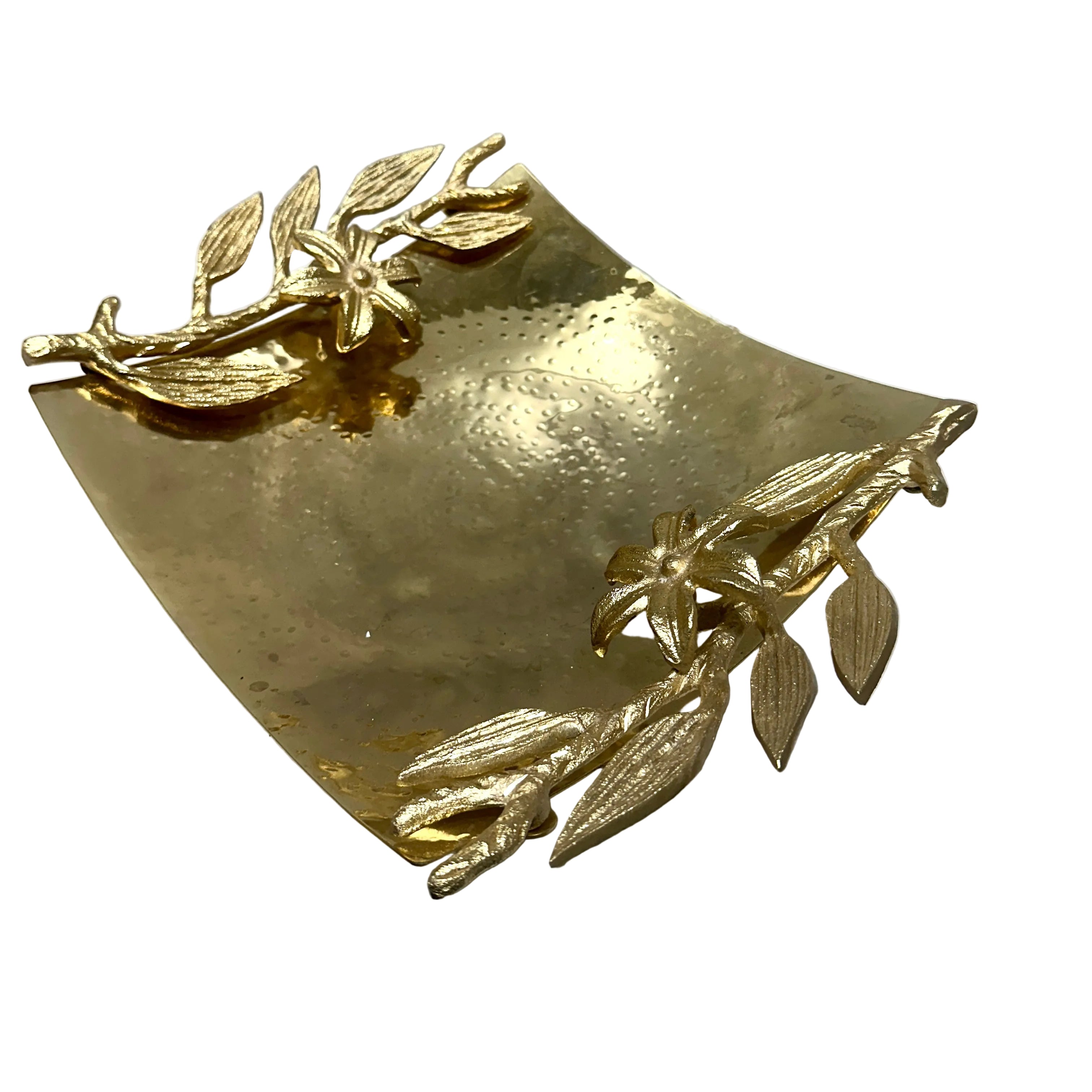 A vintage gold-toned metal tray with a hammered finish and embossed floral branch motifs, shown on a white surface.