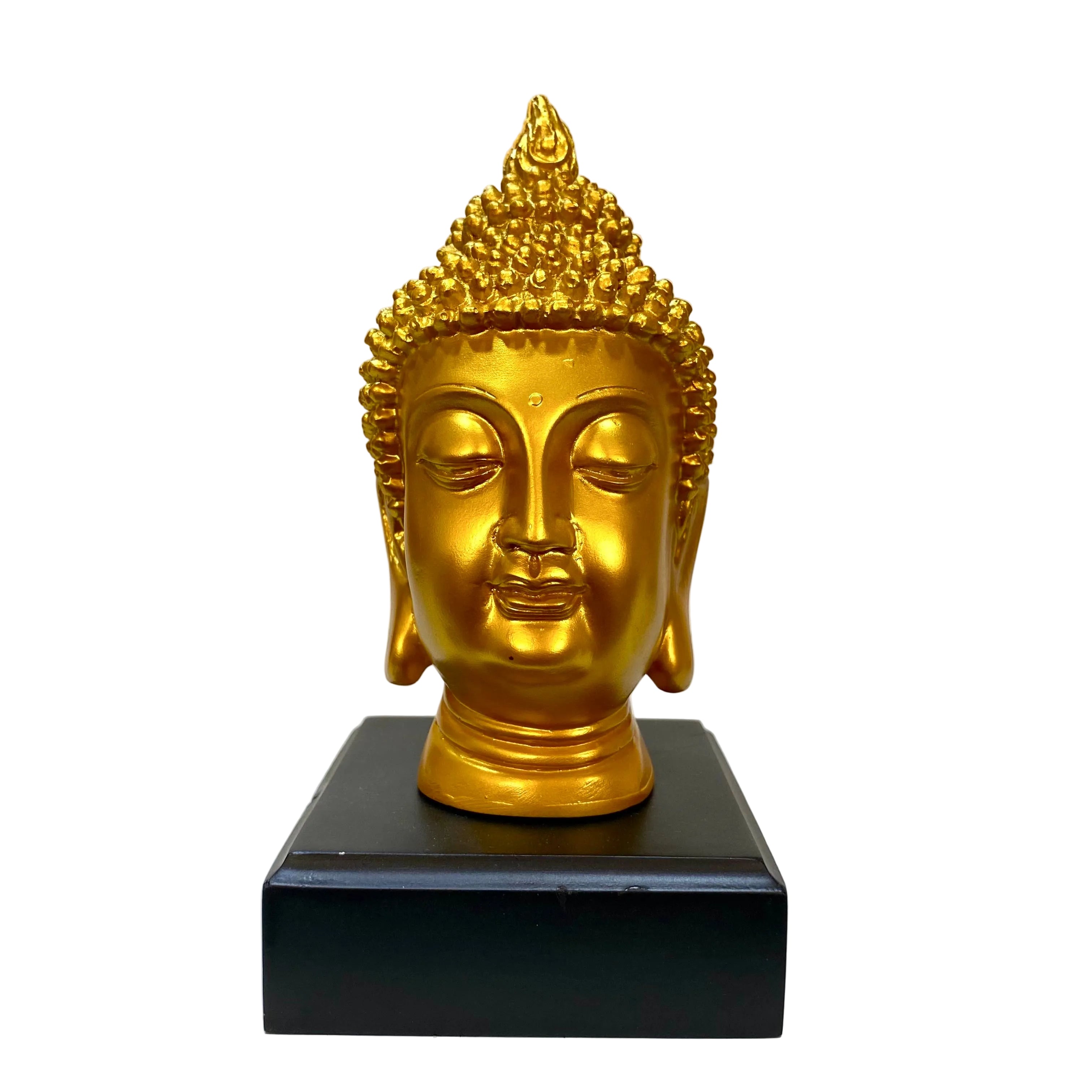 Gold Buddha head statue on a black base against a light background