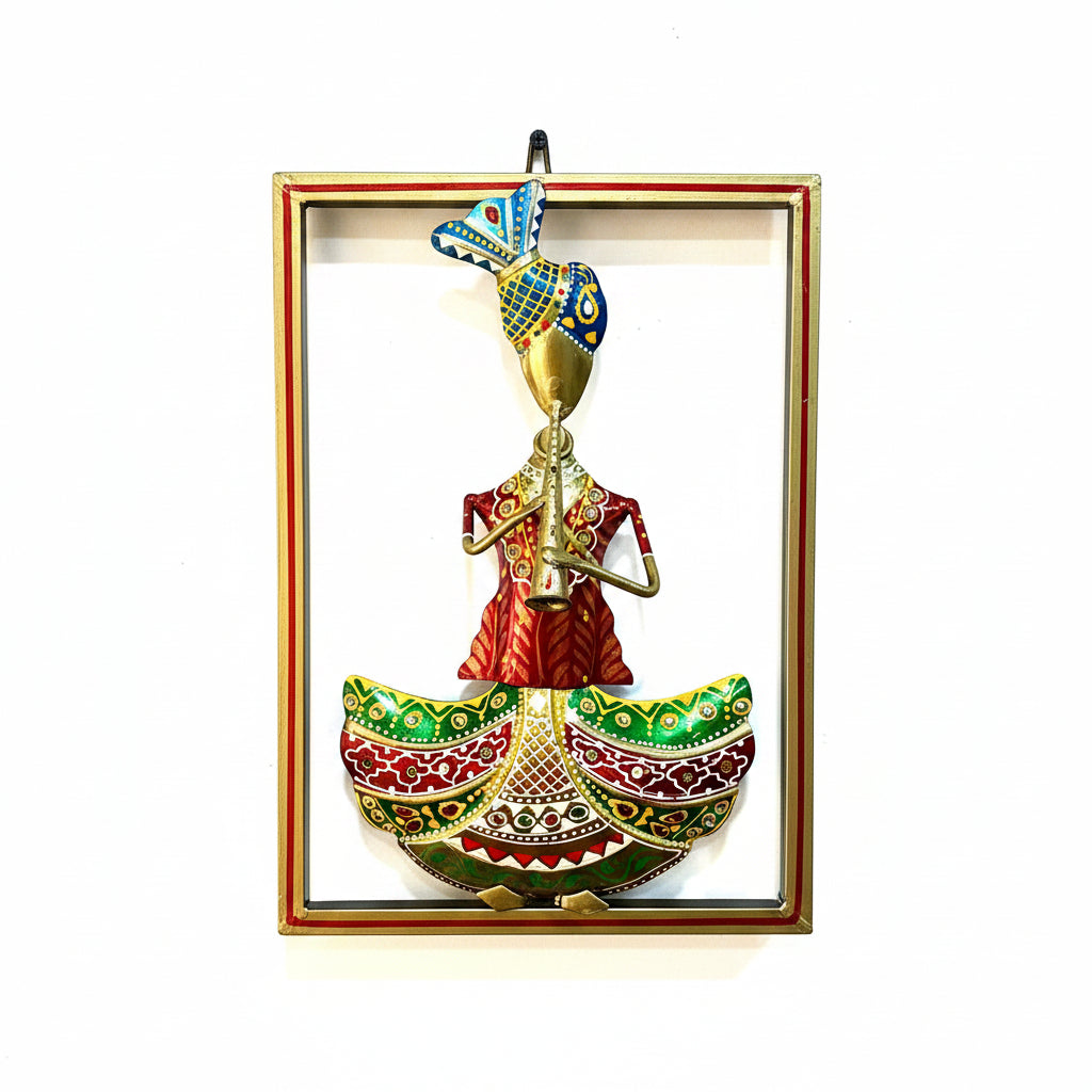 Decorative wall art of a person playing a flute with a colorful frame on a textured wall.