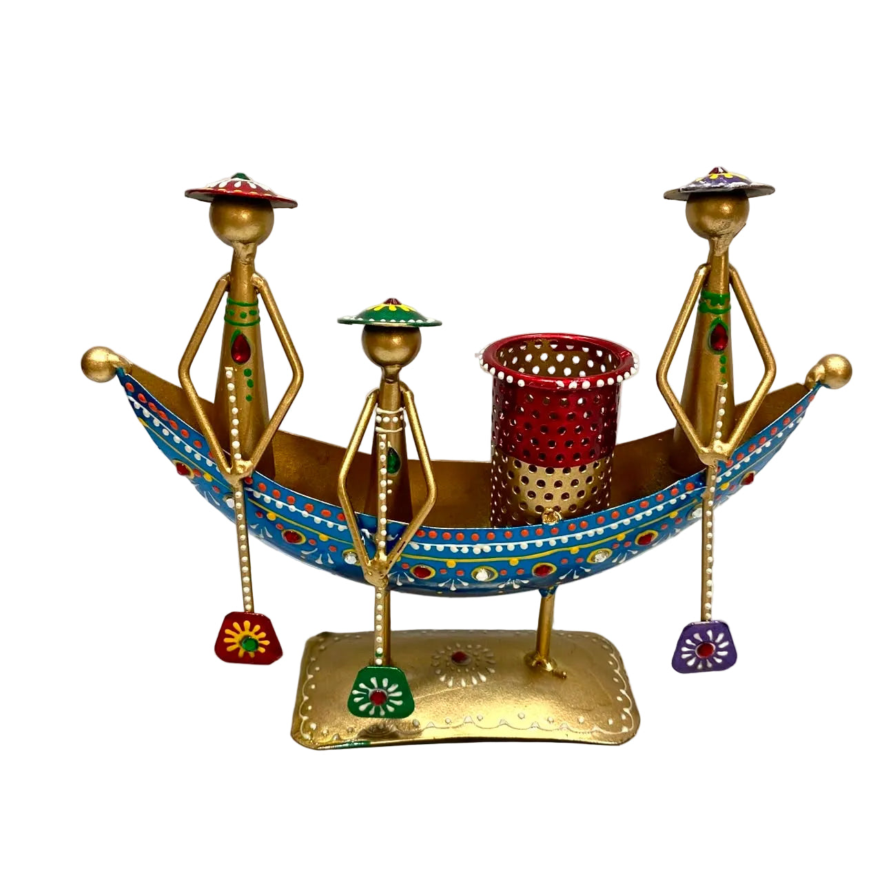 A decorative brass boat-shaped candle holder with three stylized human figures and a red perforated cup, decorated with colorful painted details, set against a plain white background.