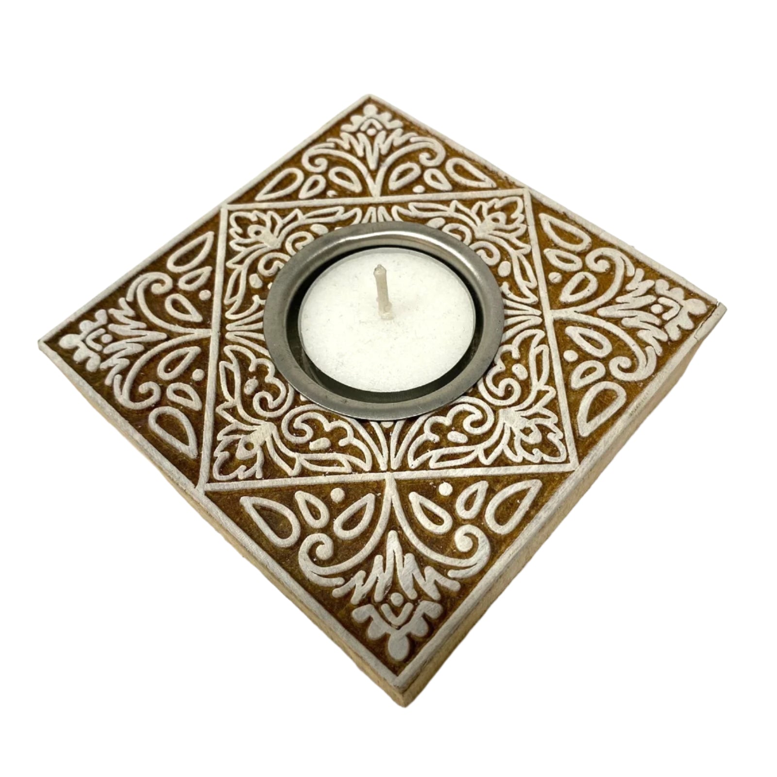 Decorative square ceramic holder with a white candle on a white background