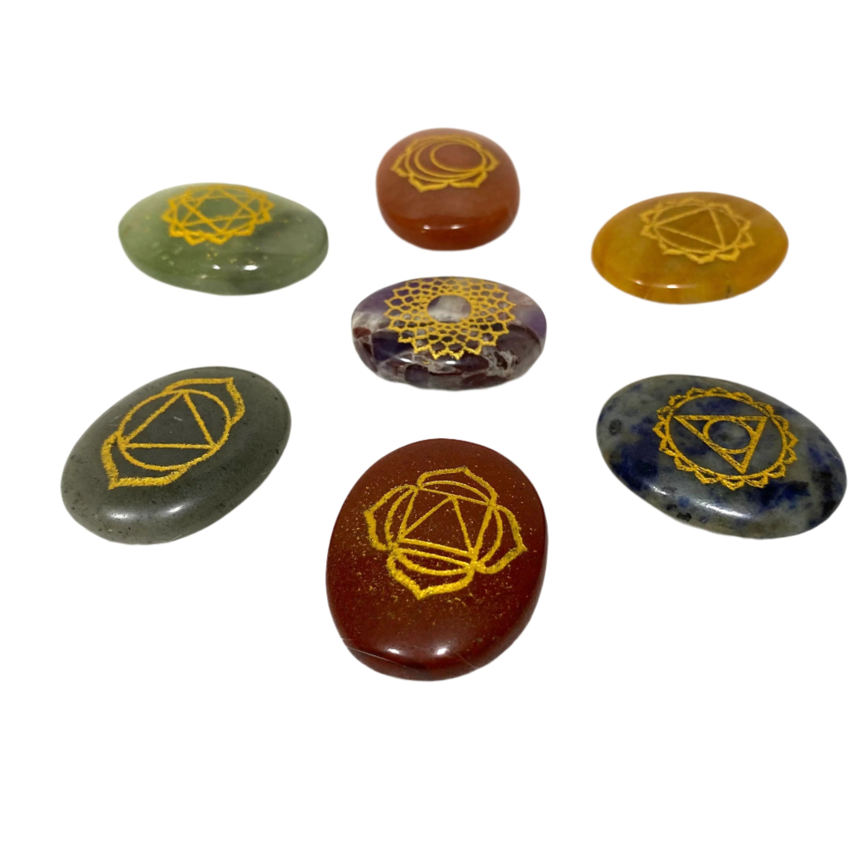 Set of seven stones with geometric symbols on a white background