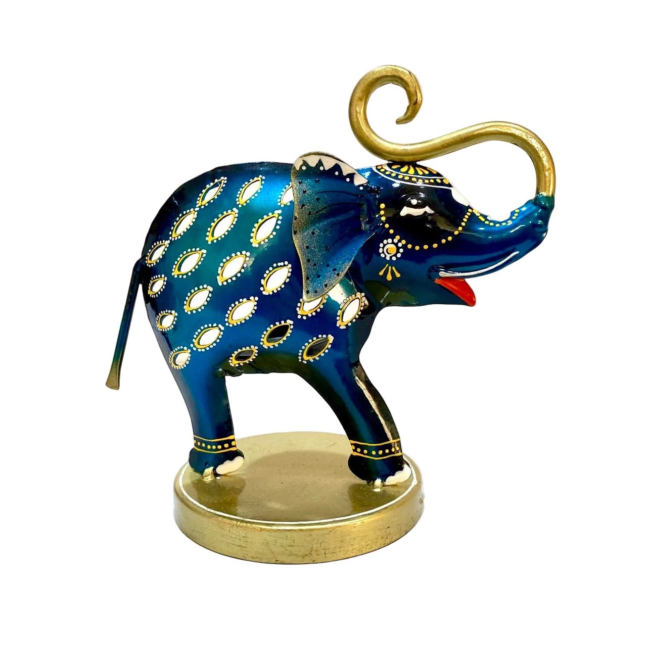 A decorative blue elephant figurine with gold accents, white pattern details, and a red tongue, standing on a round gold-colored base against a light off-white background.