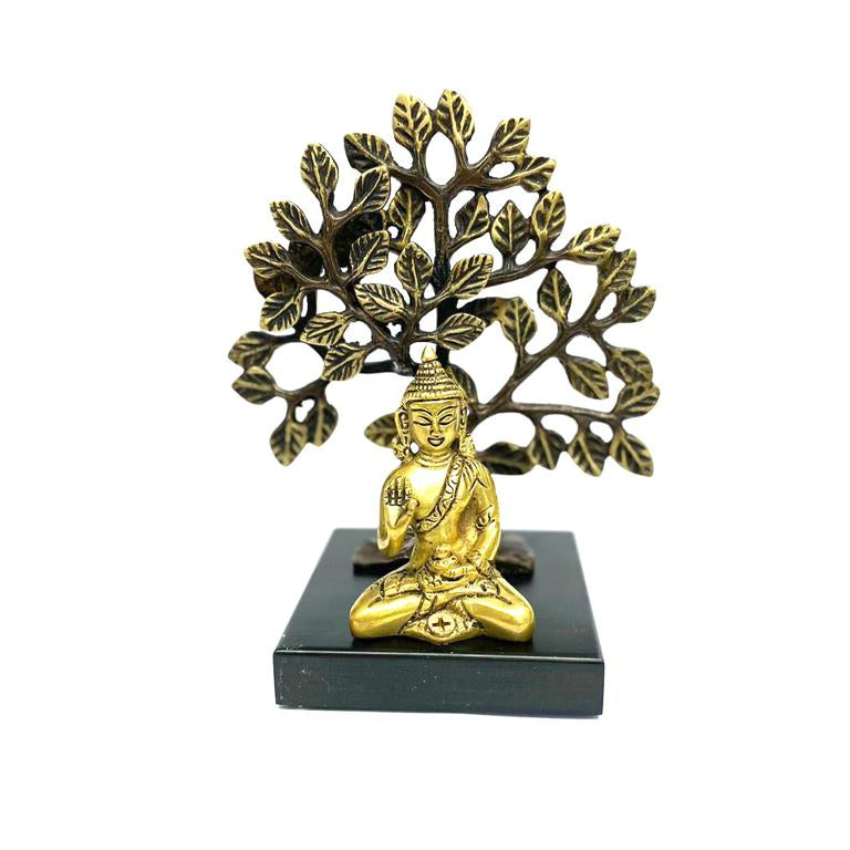 Gold Buddha statue with tree of life on a white background