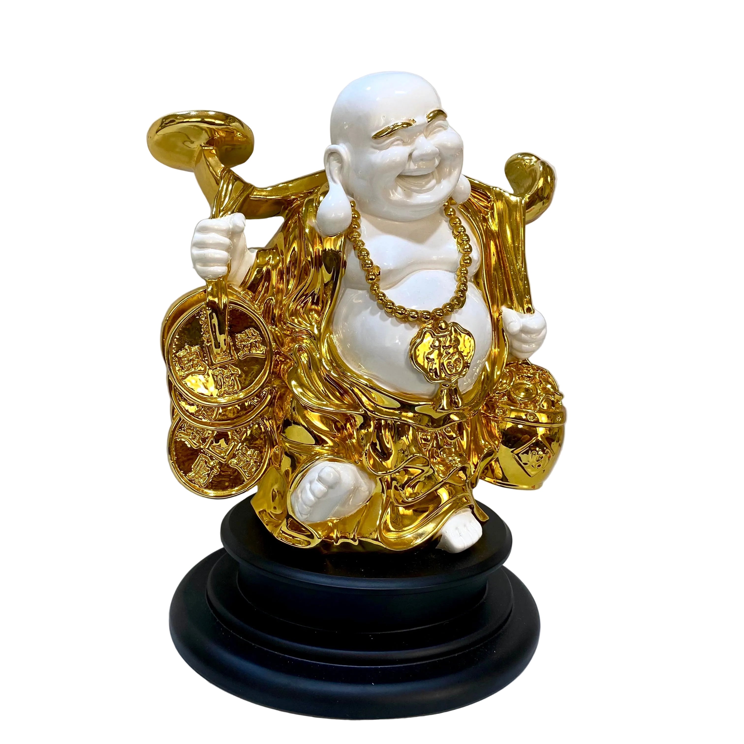 Statue of a laughing Buddha with gold accents on a black base against a plain background.
