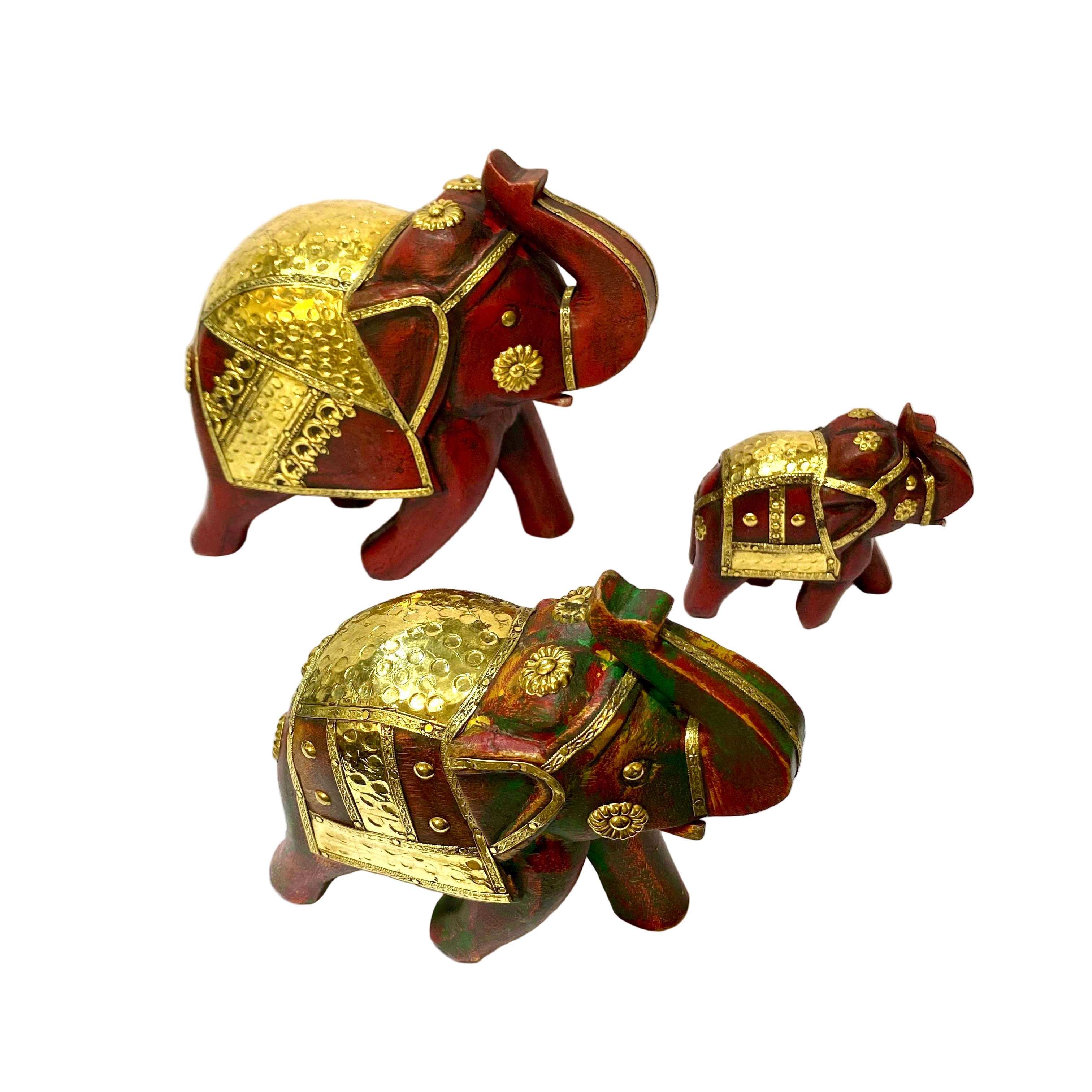 Three decorative elephant figurines with gold and red accents on a white surface.