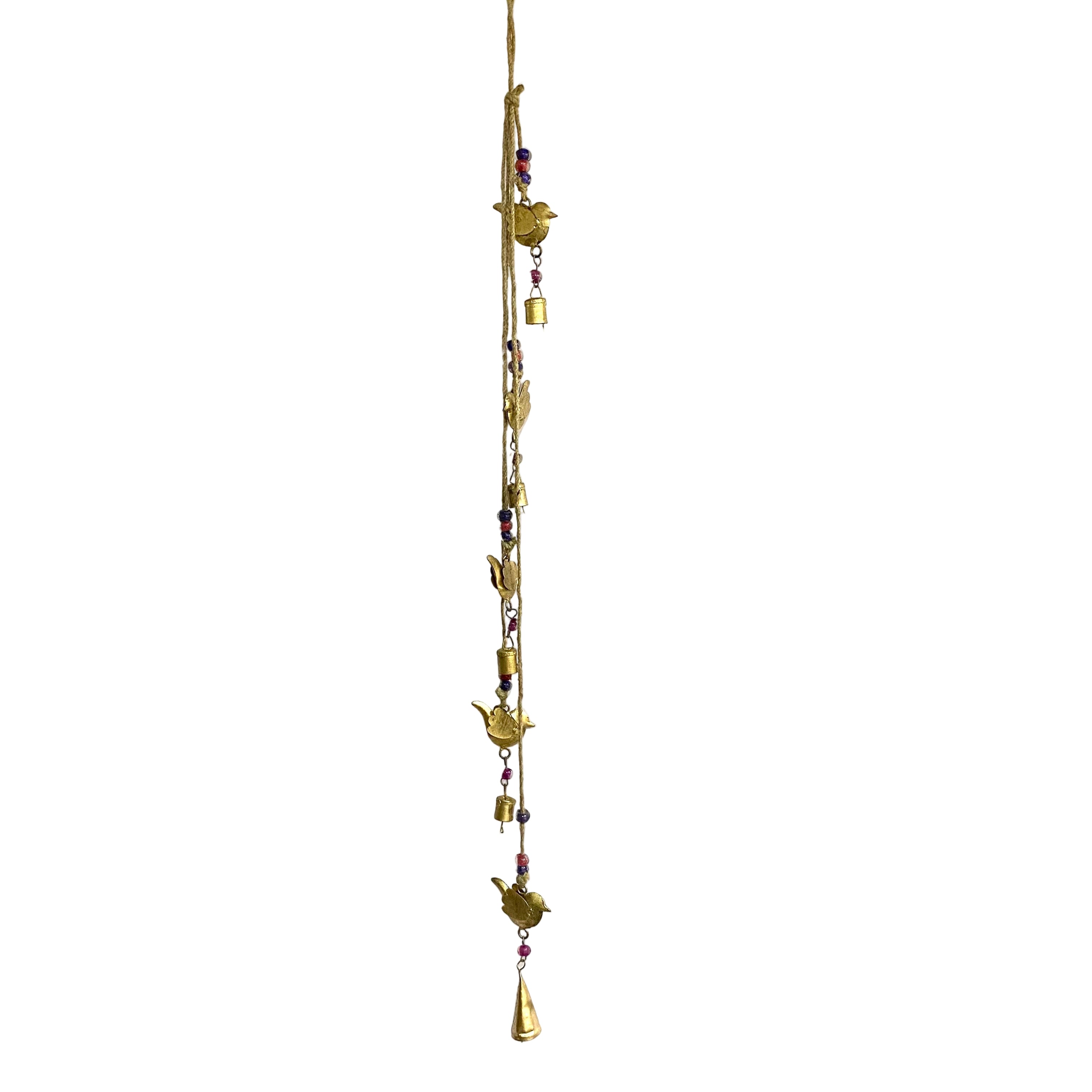 Decorative hanging with gold bells and beads against a white wall.