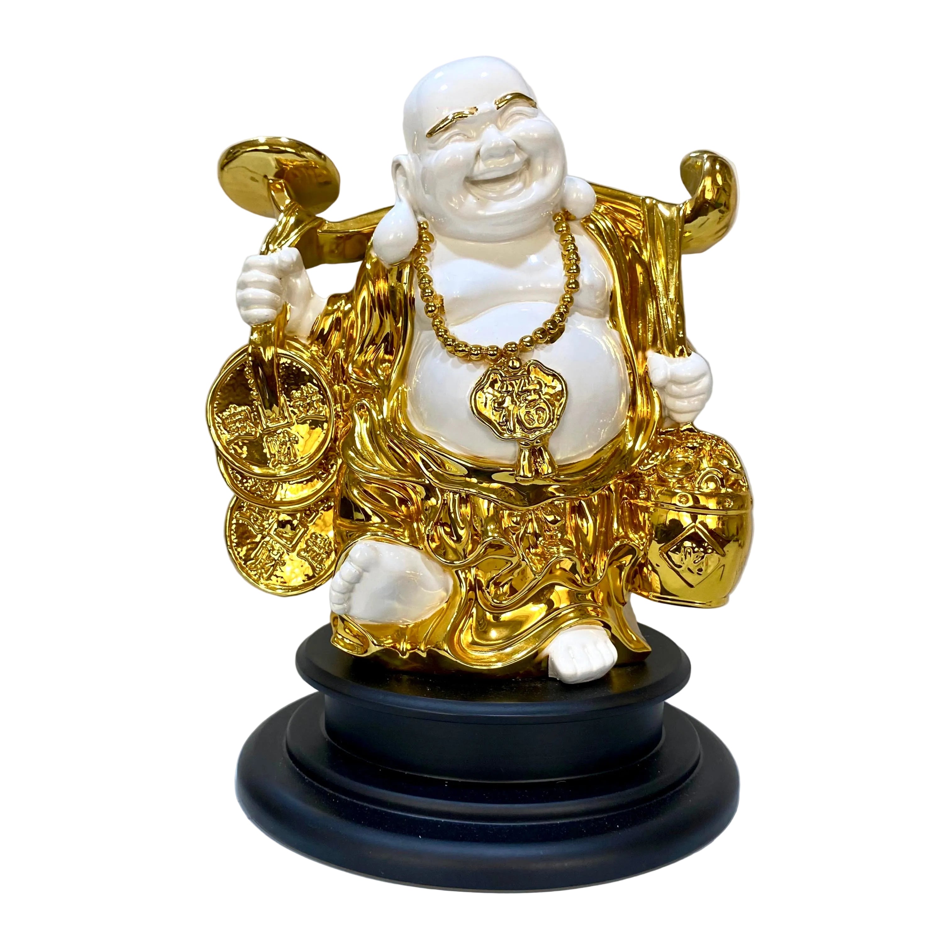 Gold and white Buddha statue on a black base against a light background