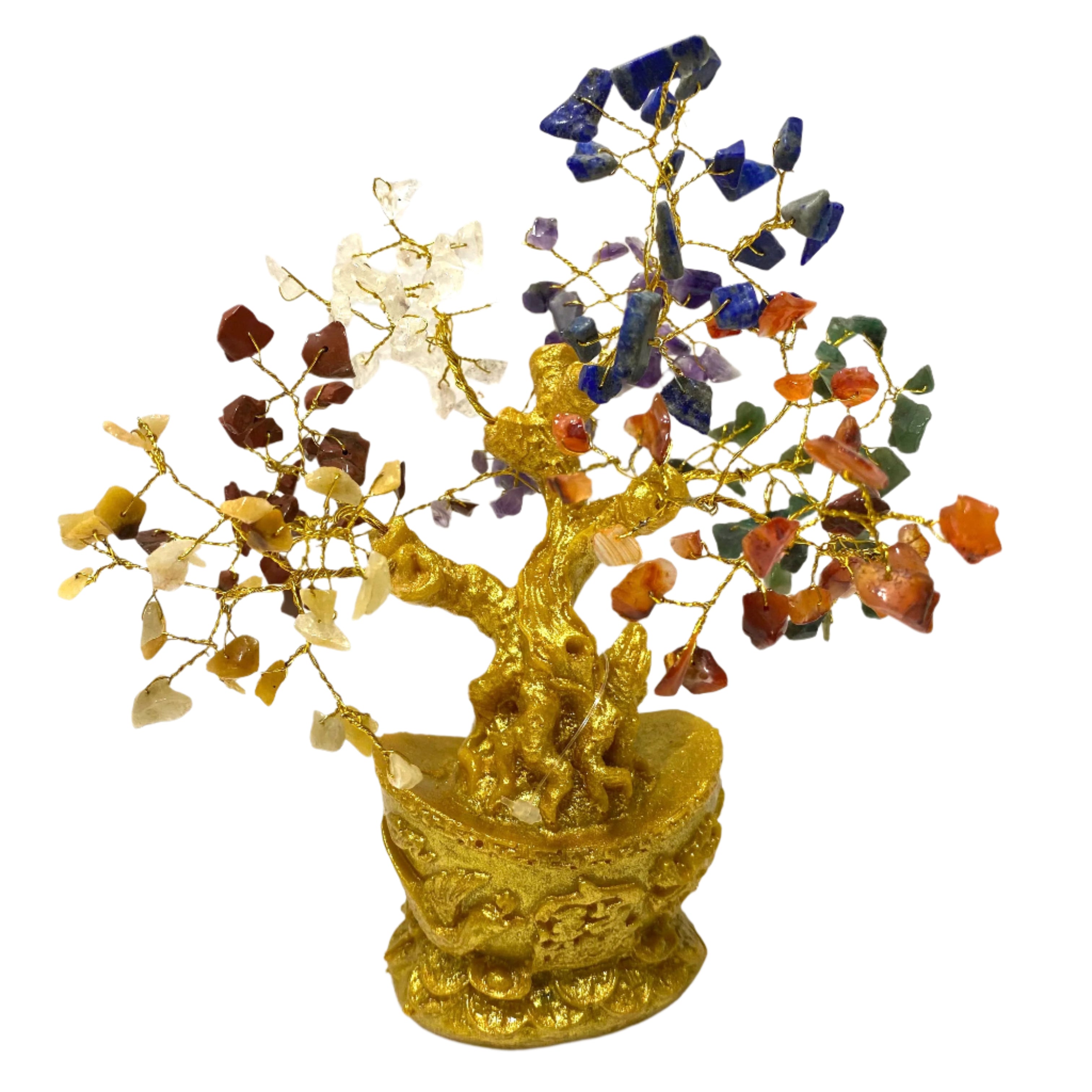 Decorative crystal tree with multicolored stones on a gold base against a white background