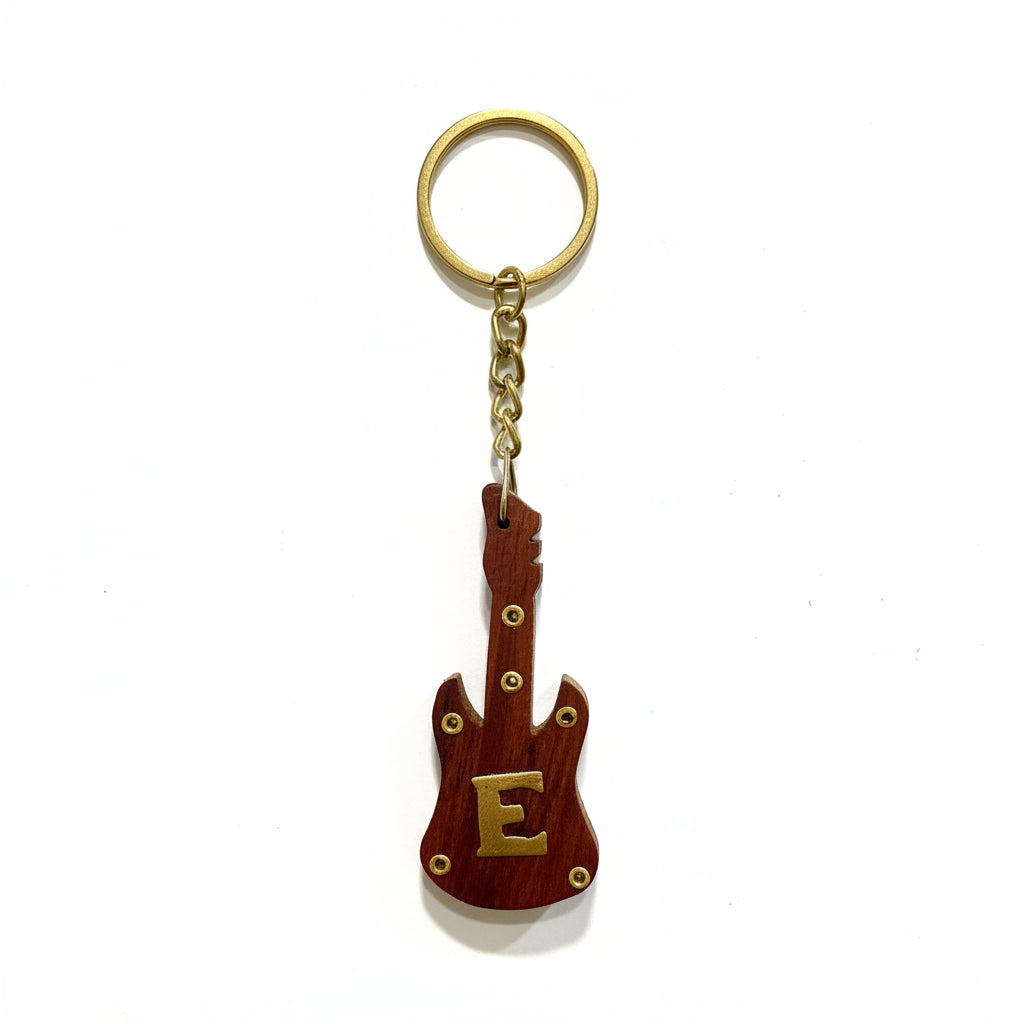 Guitar-shaped keychain with letter 'E' on a textured white background