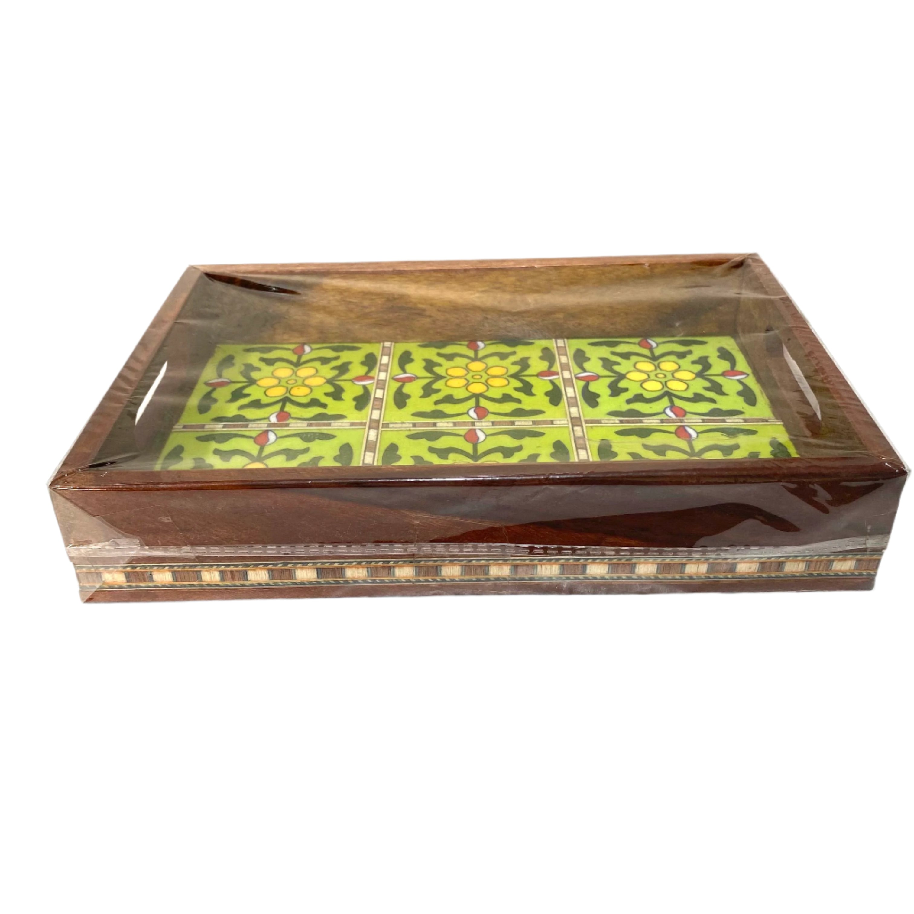 Decorative wooden box with a glass lid featuring a green floral pattern on a white background.