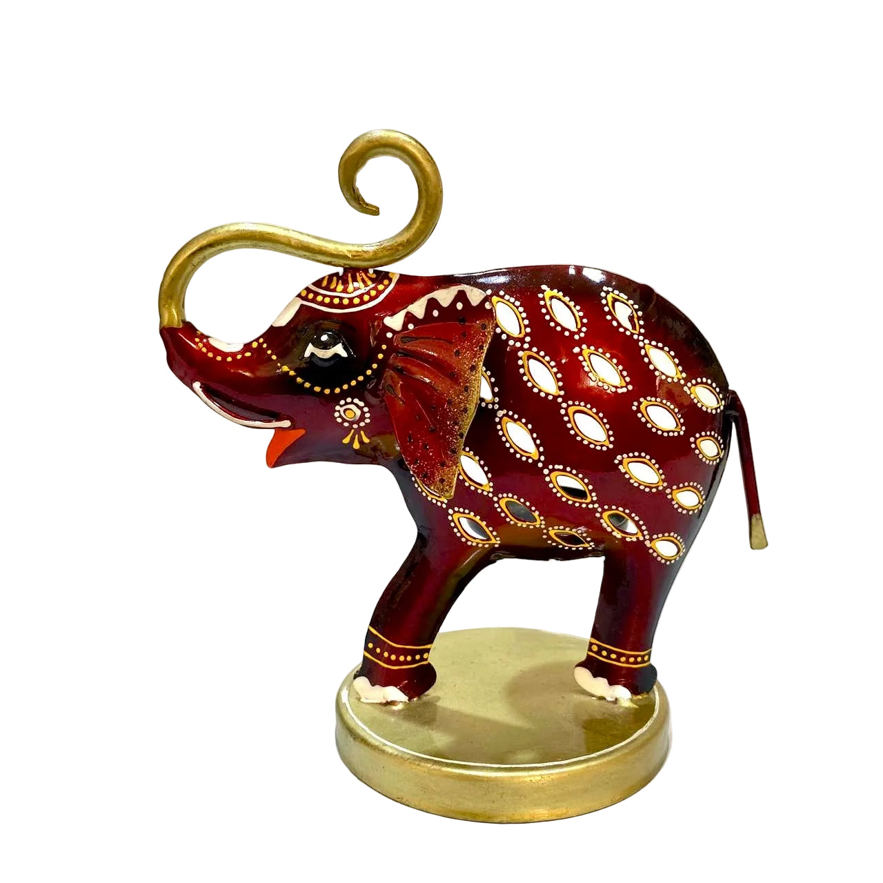 A decorative hand-painted elephant figurine in deep red with gold and white patterns, standing on a round gold-colored base.
