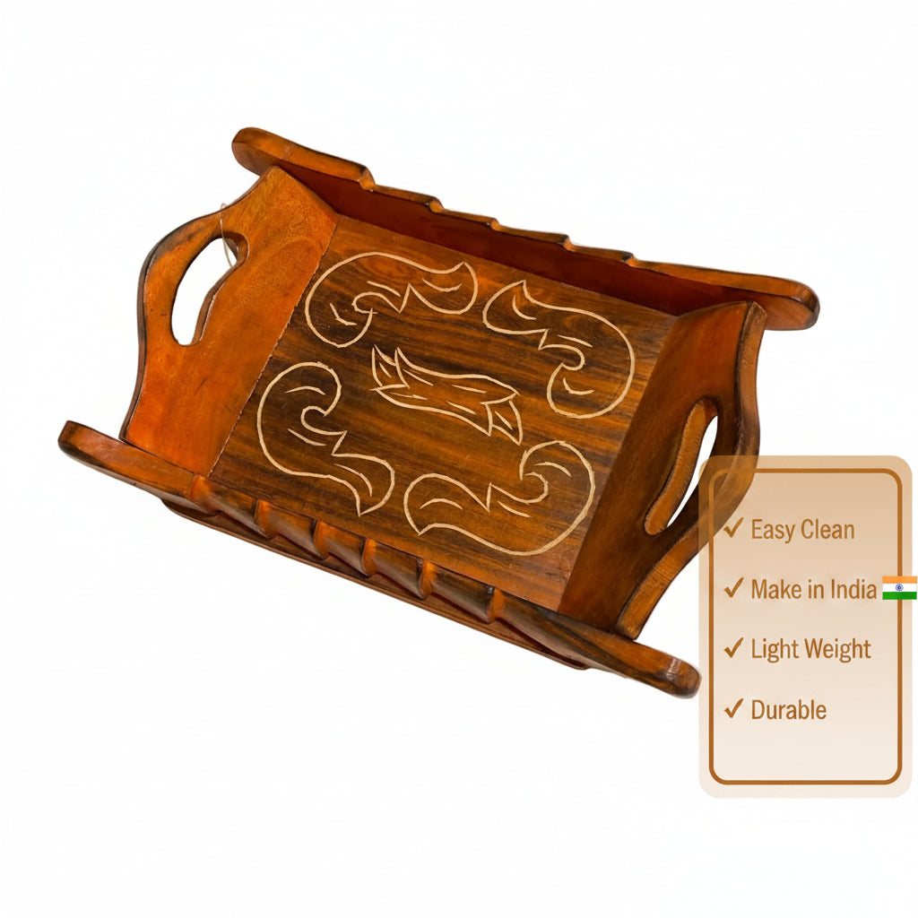 A wooden serving tray with cutout handles and a decorative inlay design on the top, photographed on a plain light surface.