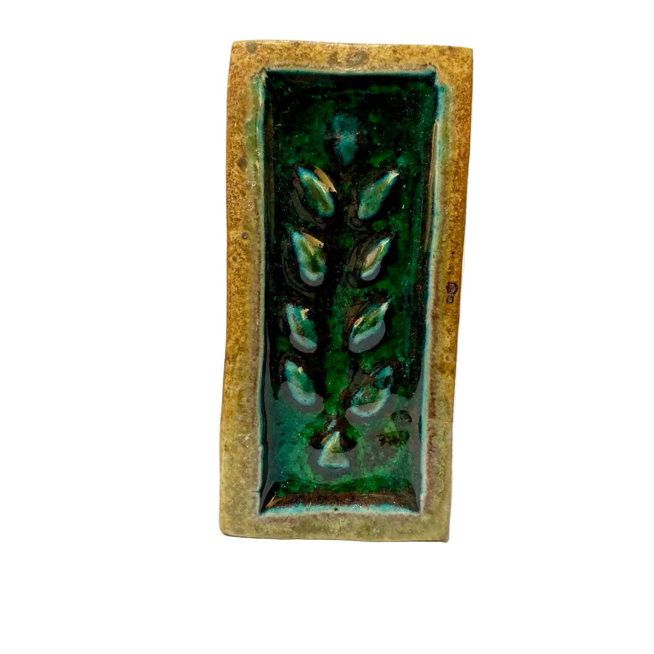 Rectangular ceramic tile with green leaf design on a white background