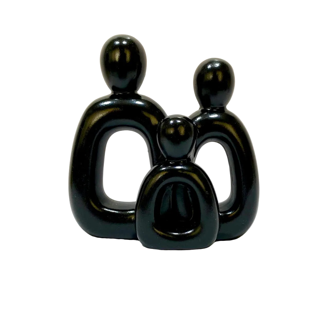 Black abstract sculpture of a family on a beige background