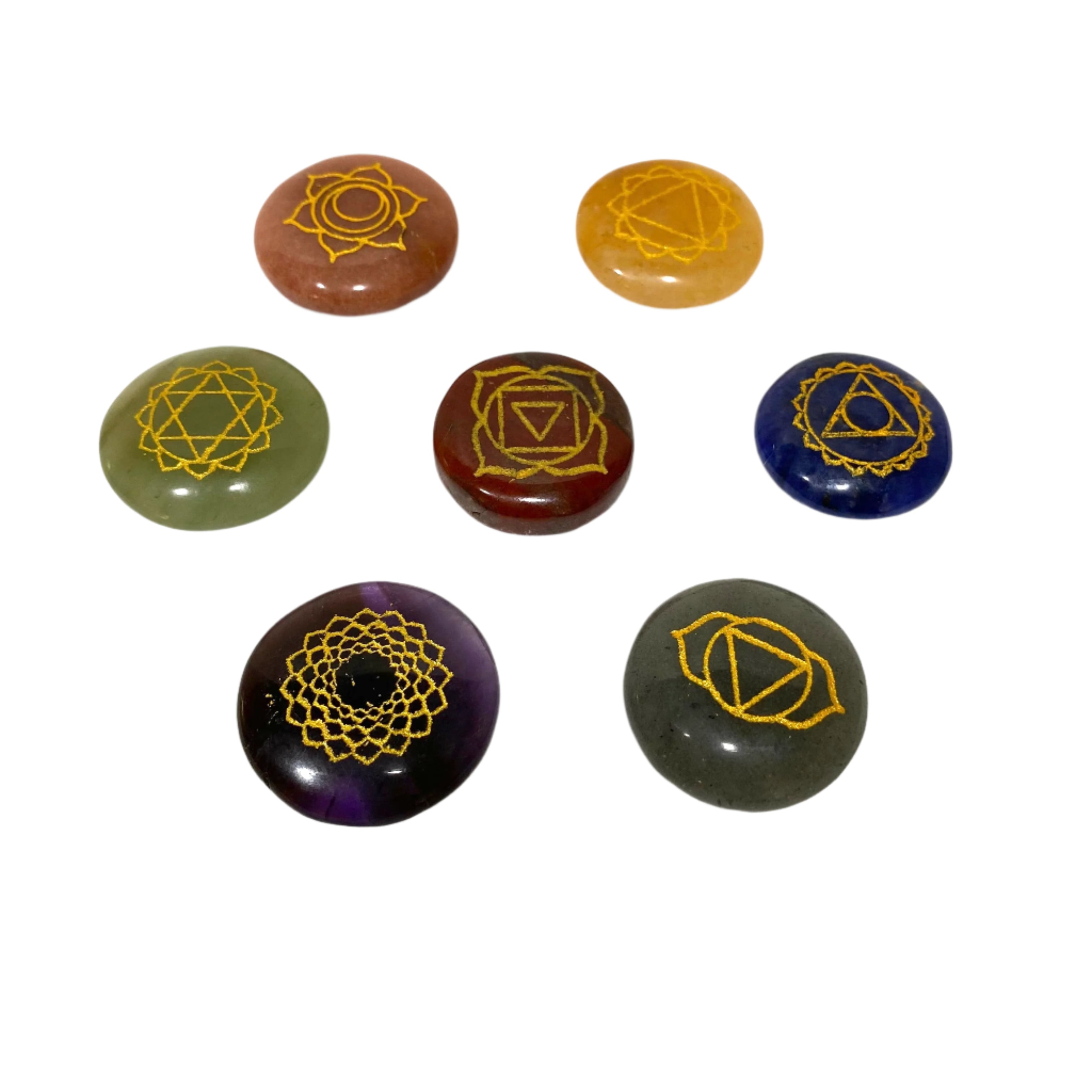 Set of seven stones with gold symbols on a white background