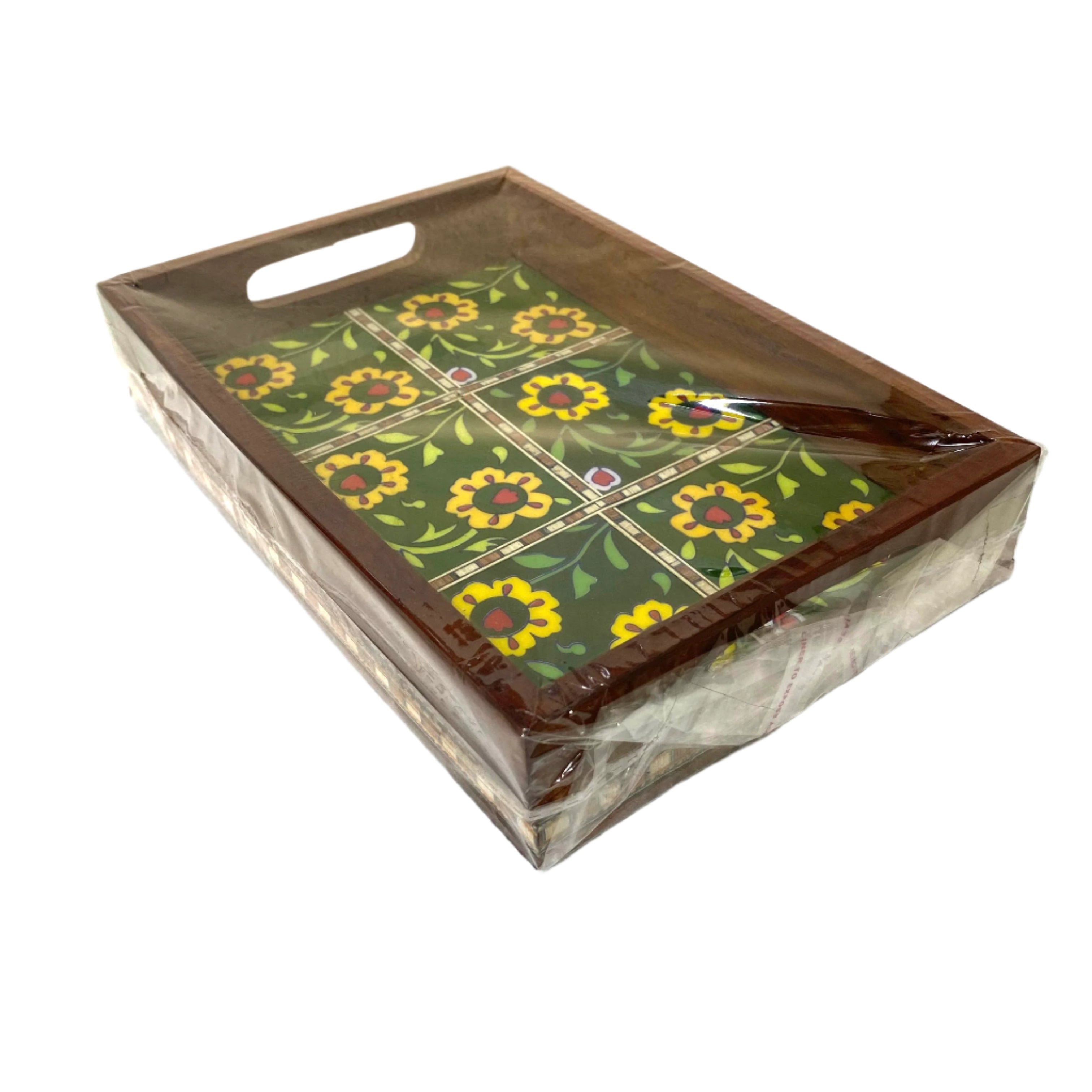 Decorative tray with floral pattern in packaging on a white surface