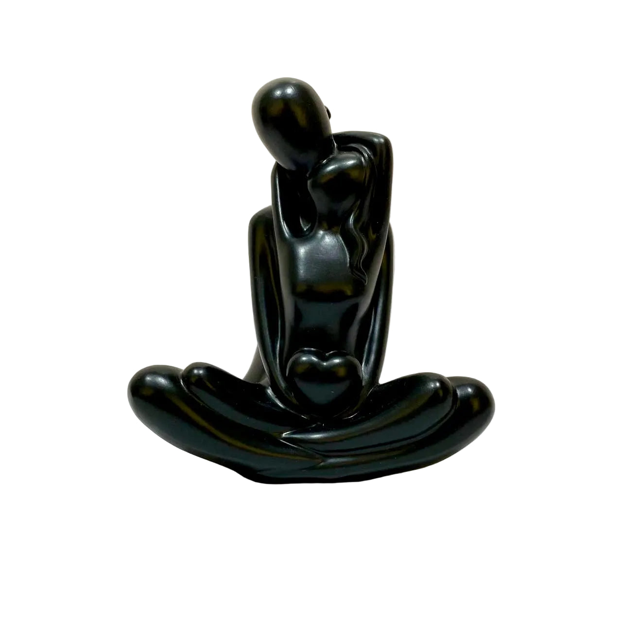 Black sculpture of a couple embracing on a white background